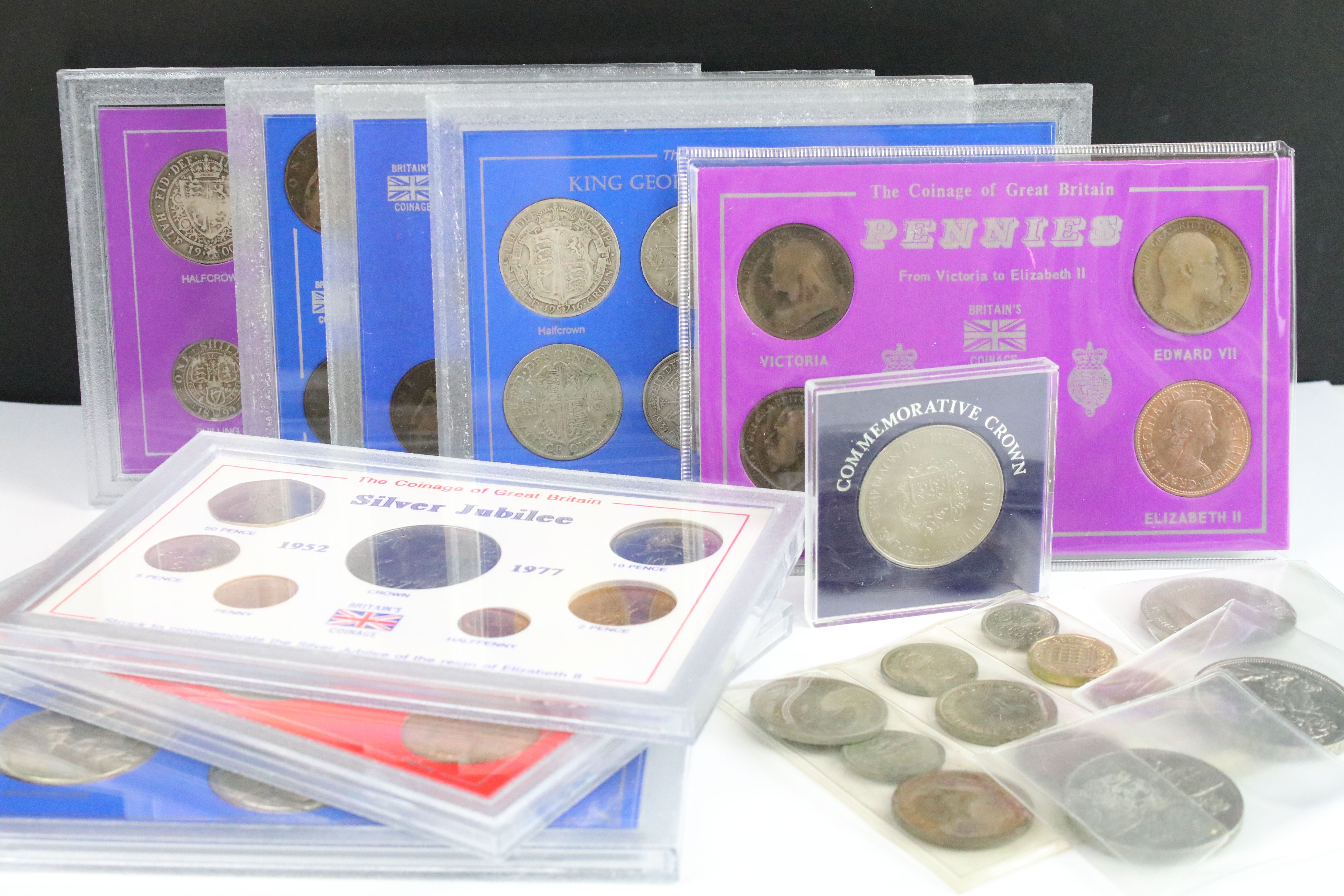 A collection of eight cased coin sets to include King Edward VII penny set, Queen Victoria penny