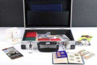 A collection of mixed coins to include commemorative and proof like examples contained within an