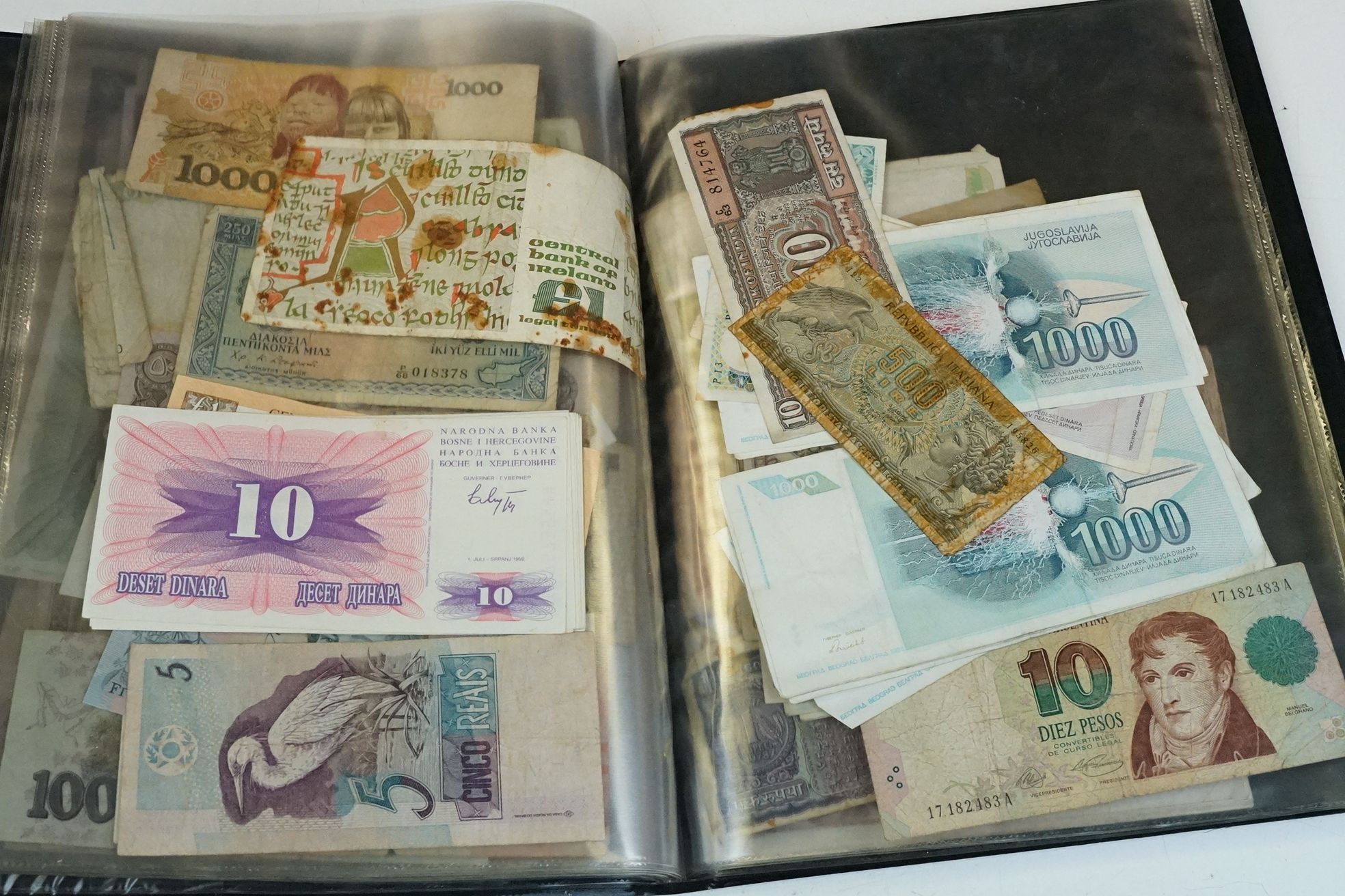 A collection of British and World banknotes contained within a folder to include China, Germany, - Bild 16 aus 19