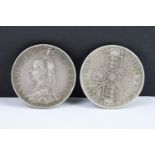 Two British Queen Victoria pre decimal silver double florin coins to include 1887 and 1889 examples.
