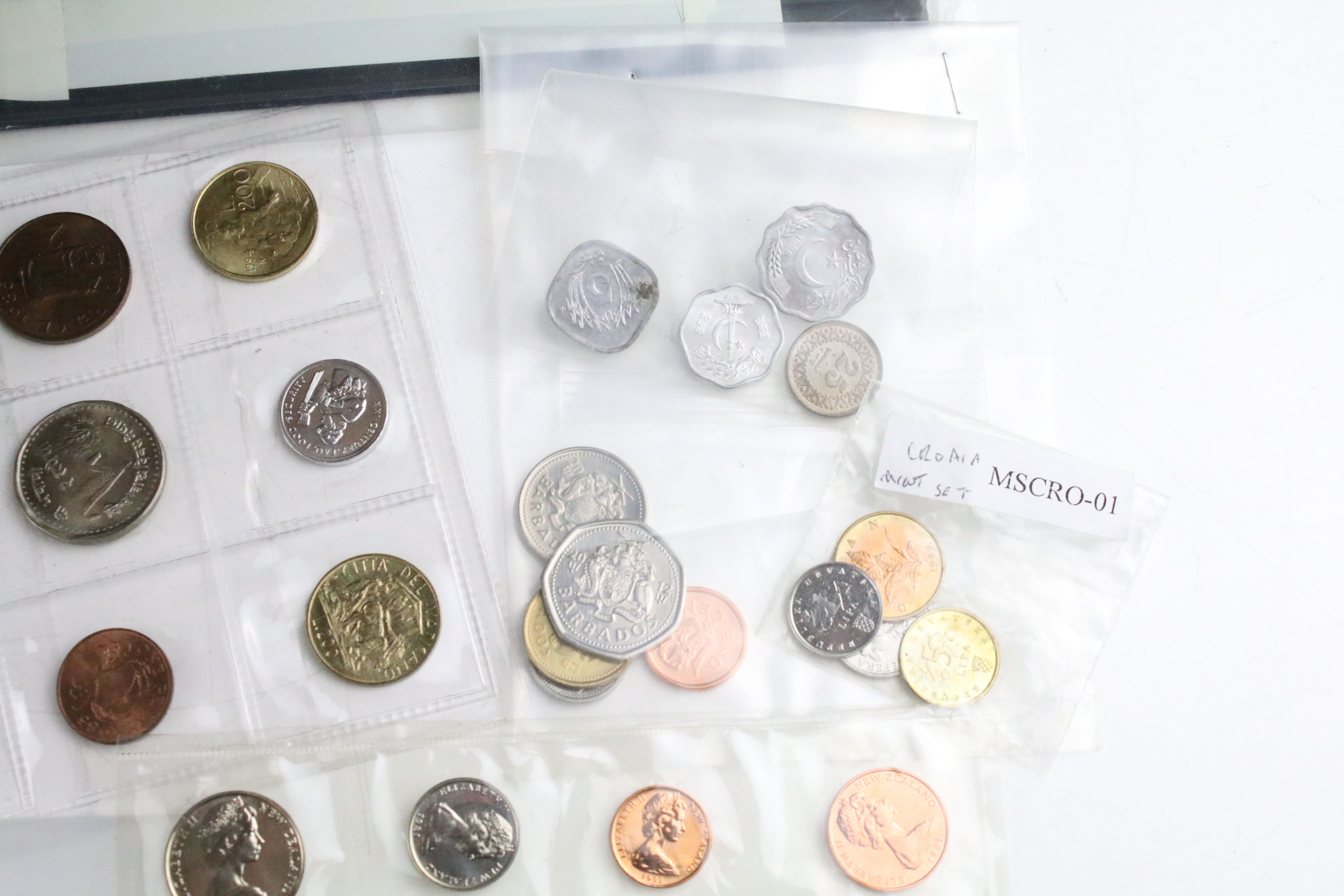 A collection of British pre decimal and World coins contained within an aluminium collectors case. - Image 6 of 11