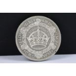 A British King George V 1927 silver Wreath Crown coin.