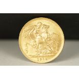 A British King George V 1914 gold full sovereign coin.