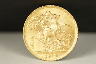 A British King George V 1914 gold full sovereign coin.