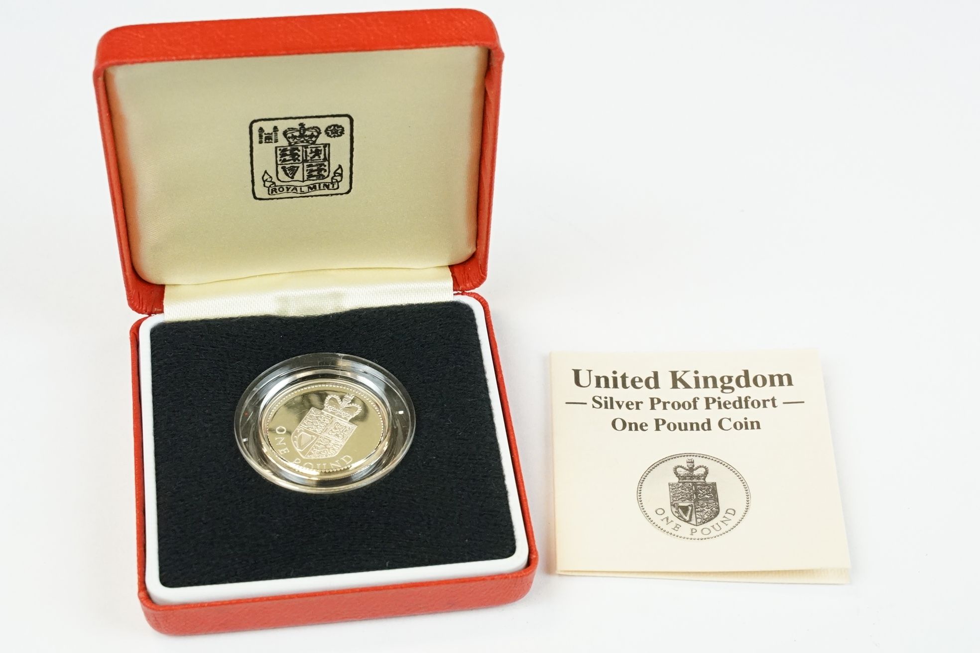 A collection of four Royal Mint silver proof £1 coins to include 2002, 1985, 1983 and 1988 examples, - Image 8 of 13