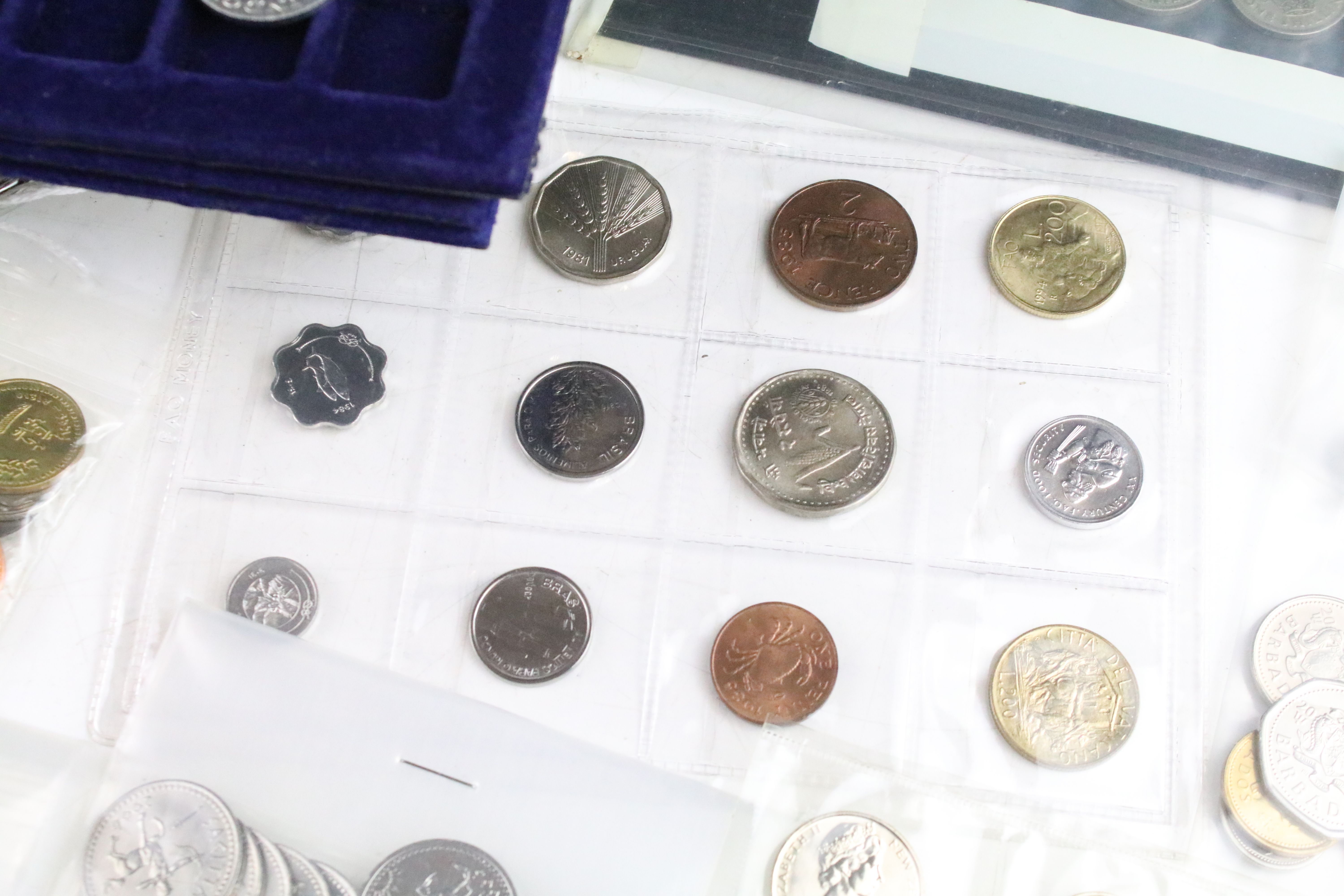 A collection of British pre decimal and World coins contained within an aluminium collectors case. - Image 7 of 11