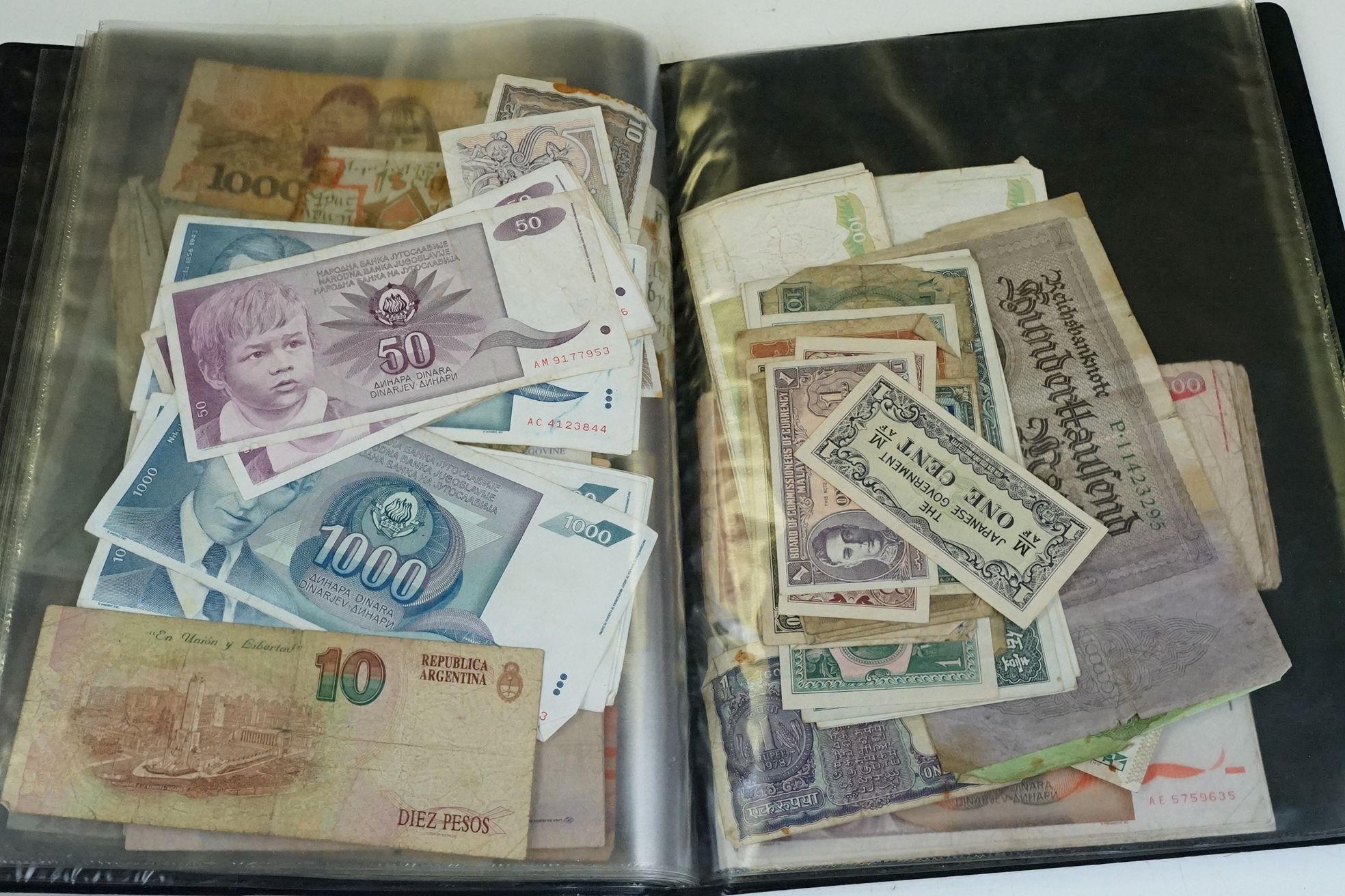A collection of British and World banknotes contained within a folder to include China, Germany, - Bild 17 aus 19