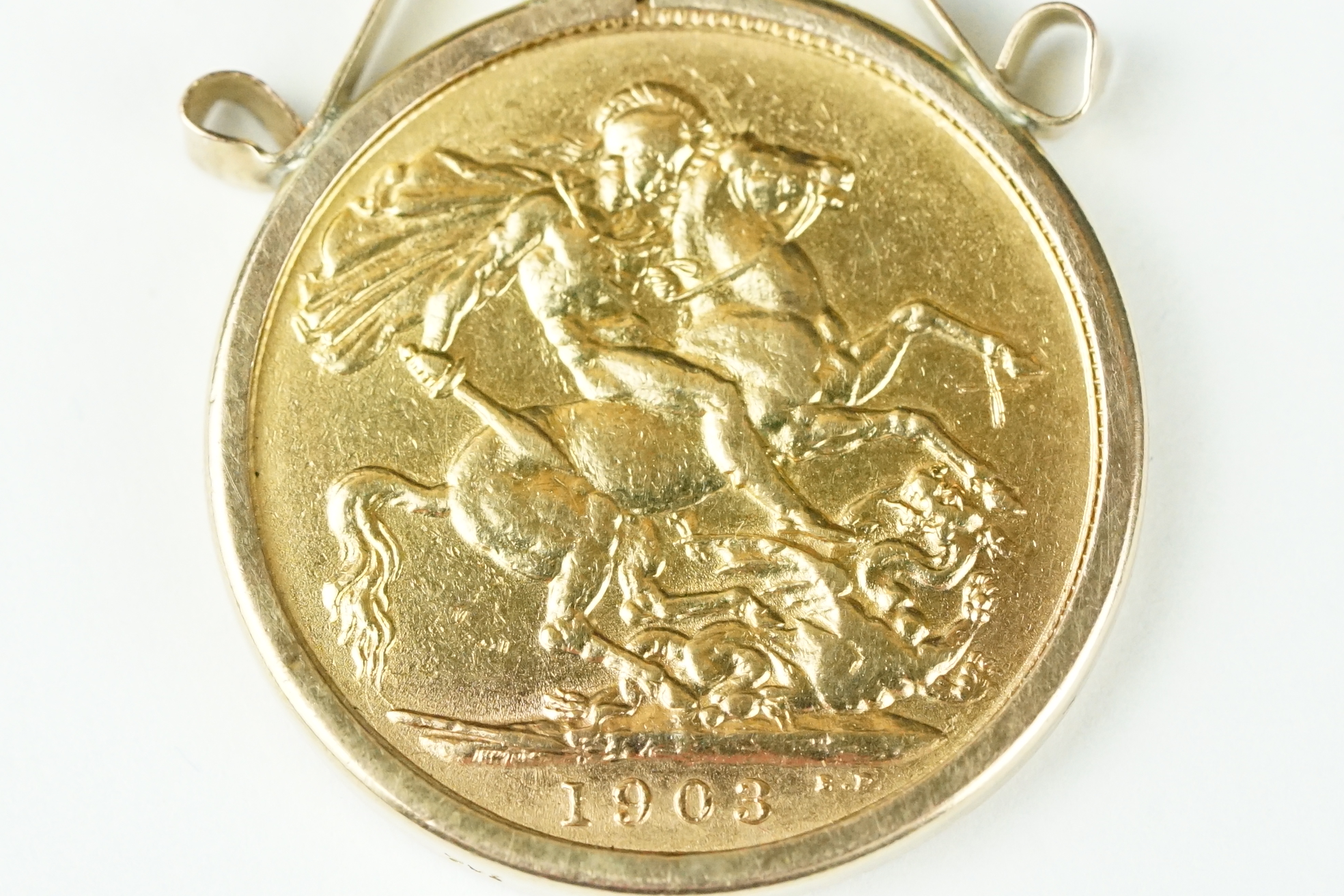 A British King Edward VII 1903 gold full sovereign coin mounted within a 9ct gold mount. - Image 2 of 8