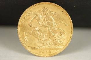 A British King George V 1912 gold full sovereign coin.