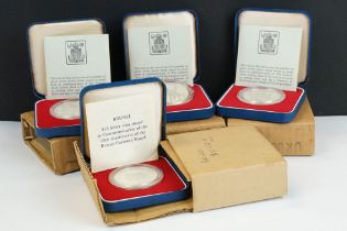 A collection of four silver proof coins to include three 1977 Queen's Silver Jubilee examples, all