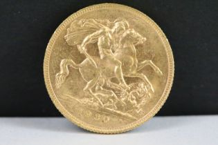 A King George V 1930 gold full sovereign coin with Perth Mint mark.