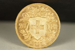 A Switzerland Helvetia 1927 20 Franc gold coin.