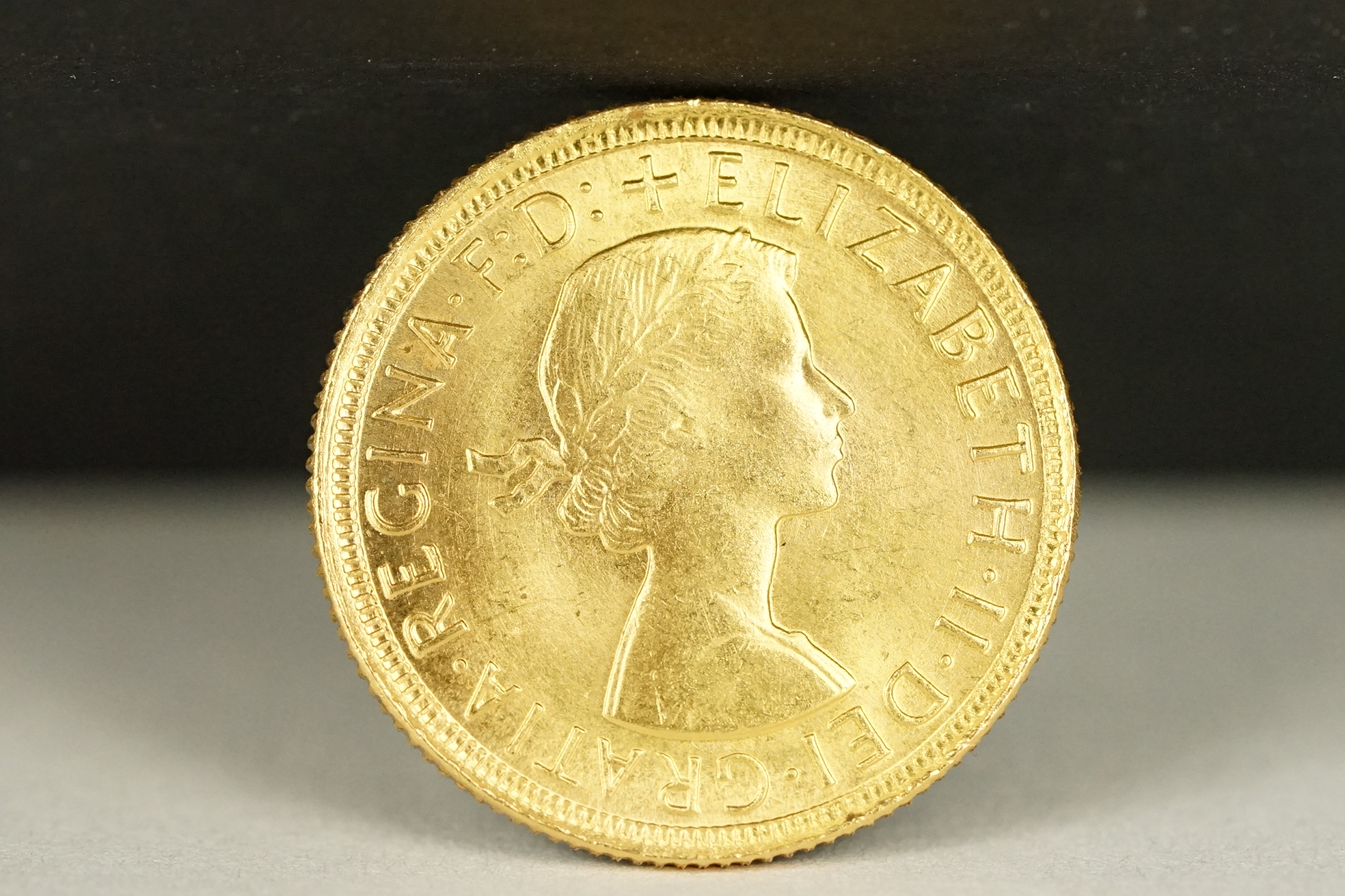 A British Queen Elizabeth II 1957 gold full sovereign coin. - Image 2 of 3