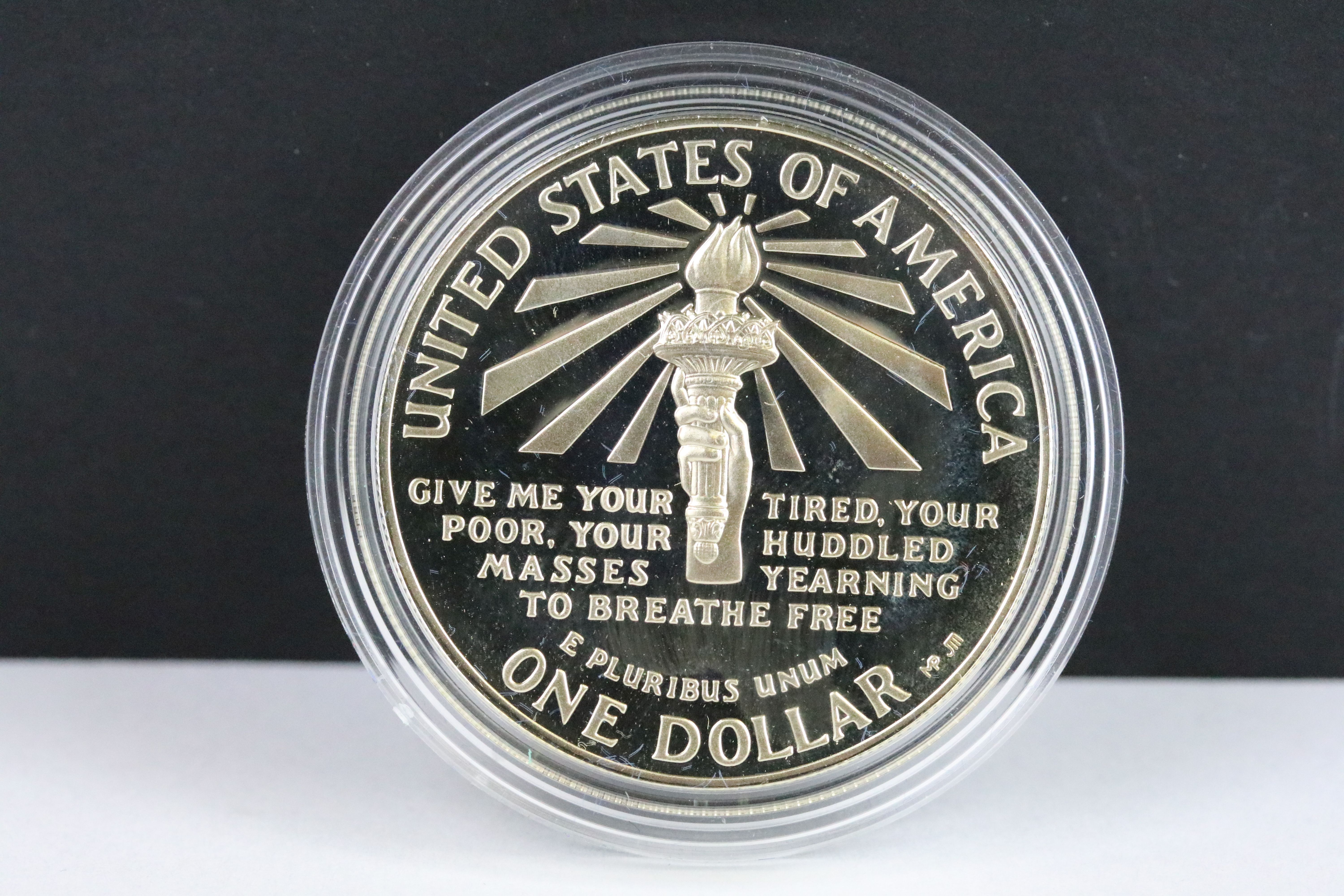 A cased United States of America Liberty coin set comprising of the 1986 silver dollar and half - Image 3 of 6