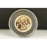 A British Queen Elizabeth II 2006 uncirculated gold full sovereign coin.