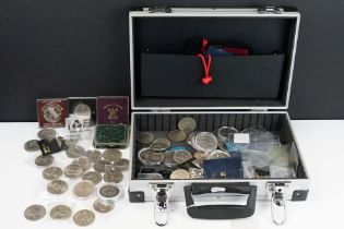 A collection of mainly British uncirculated commemorative crowns contained within an aluminium