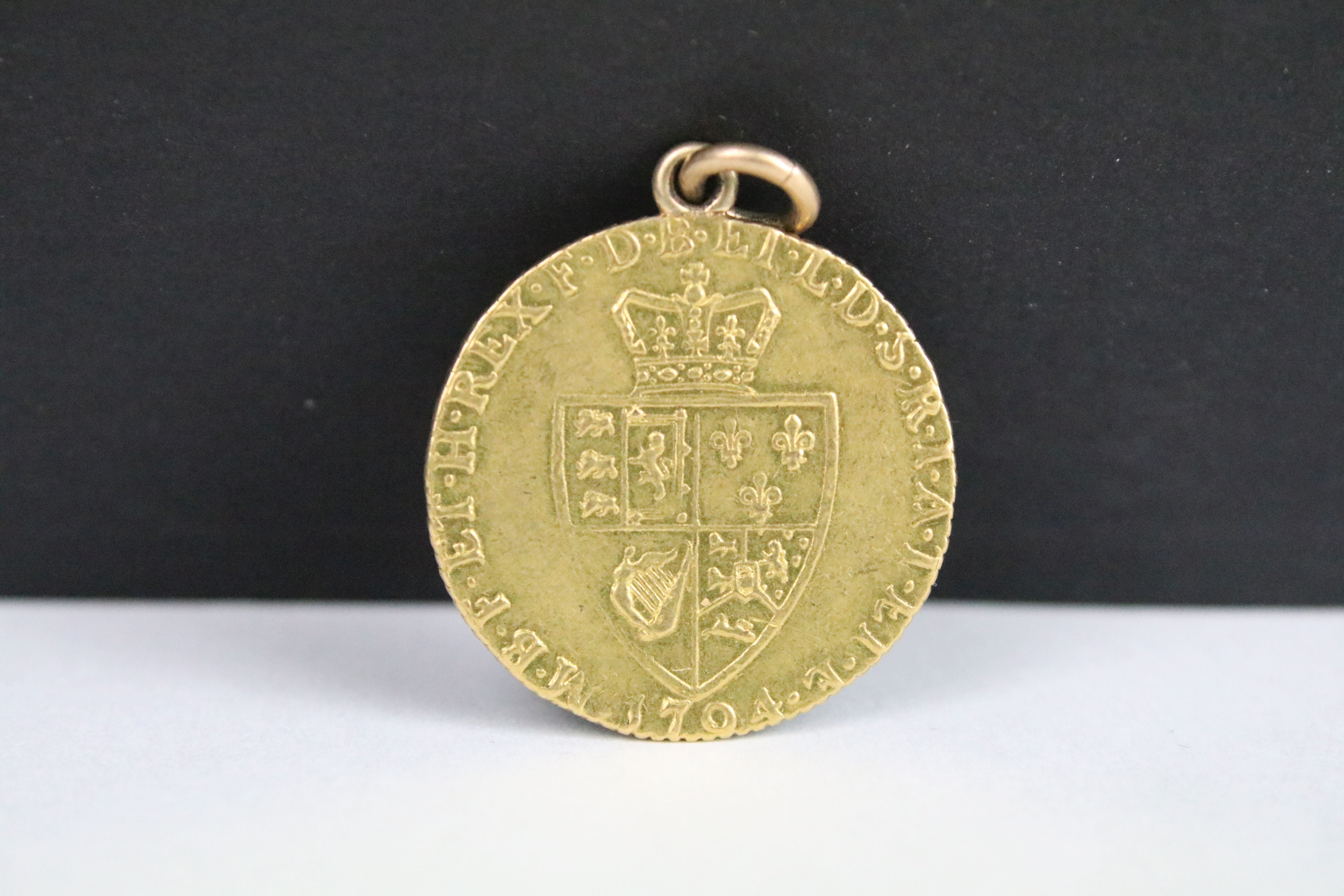 A British King George III 1794 gold full guinea coin.