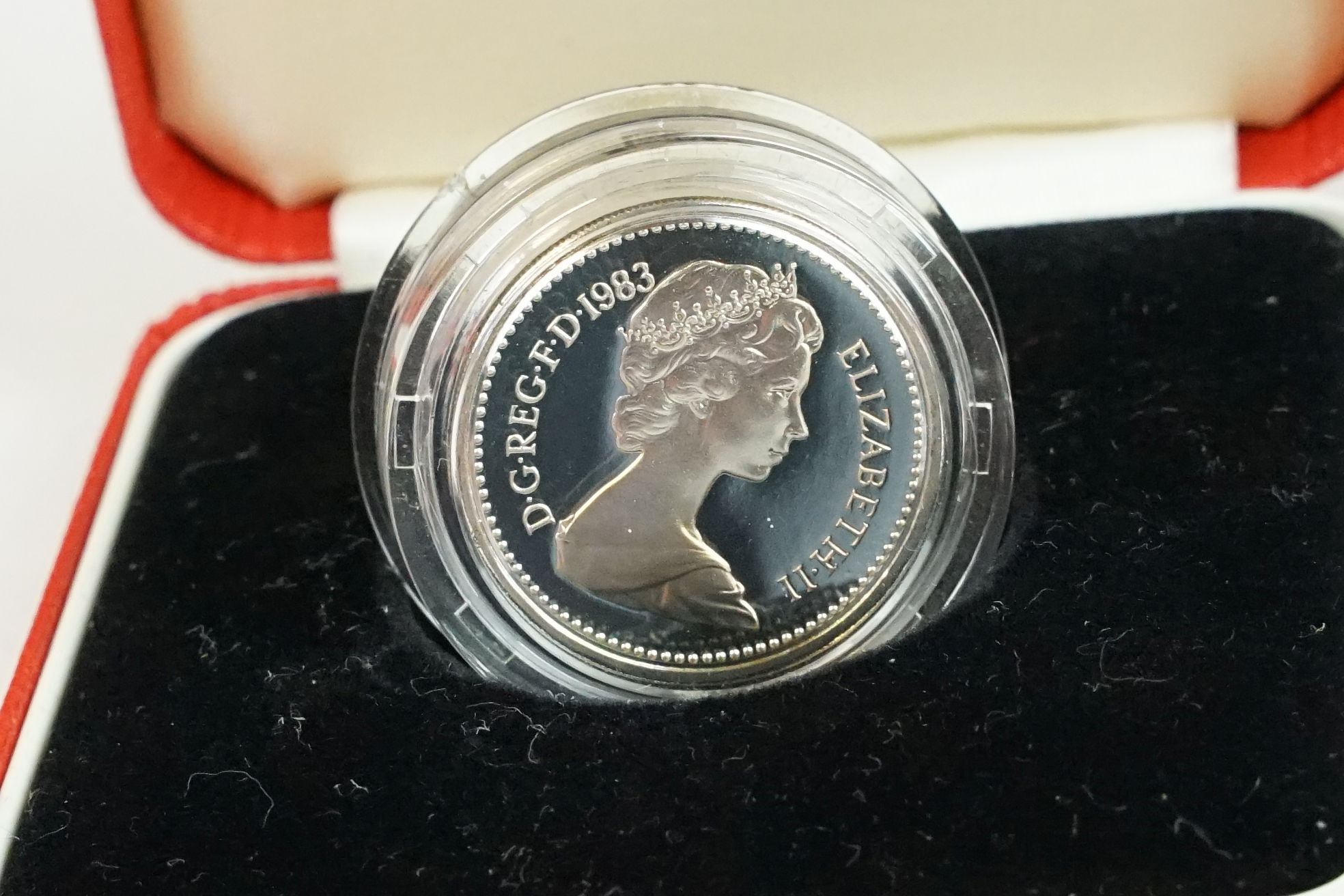 A collection of four Royal Mint silver proof £1 coins to include 2002, 1985, 1983 and 1988 examples, - Image 4 of 13