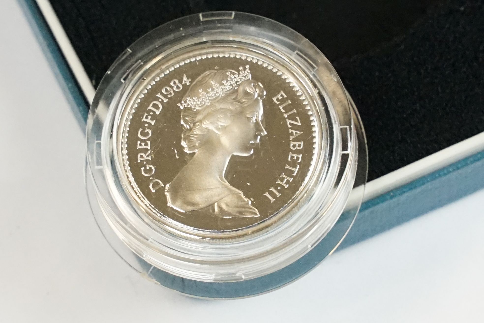A collection of four Royal Mint silver proof £1 coins to include 2002, 2003, 1989 and 1984 examples, - Image 13 of 13