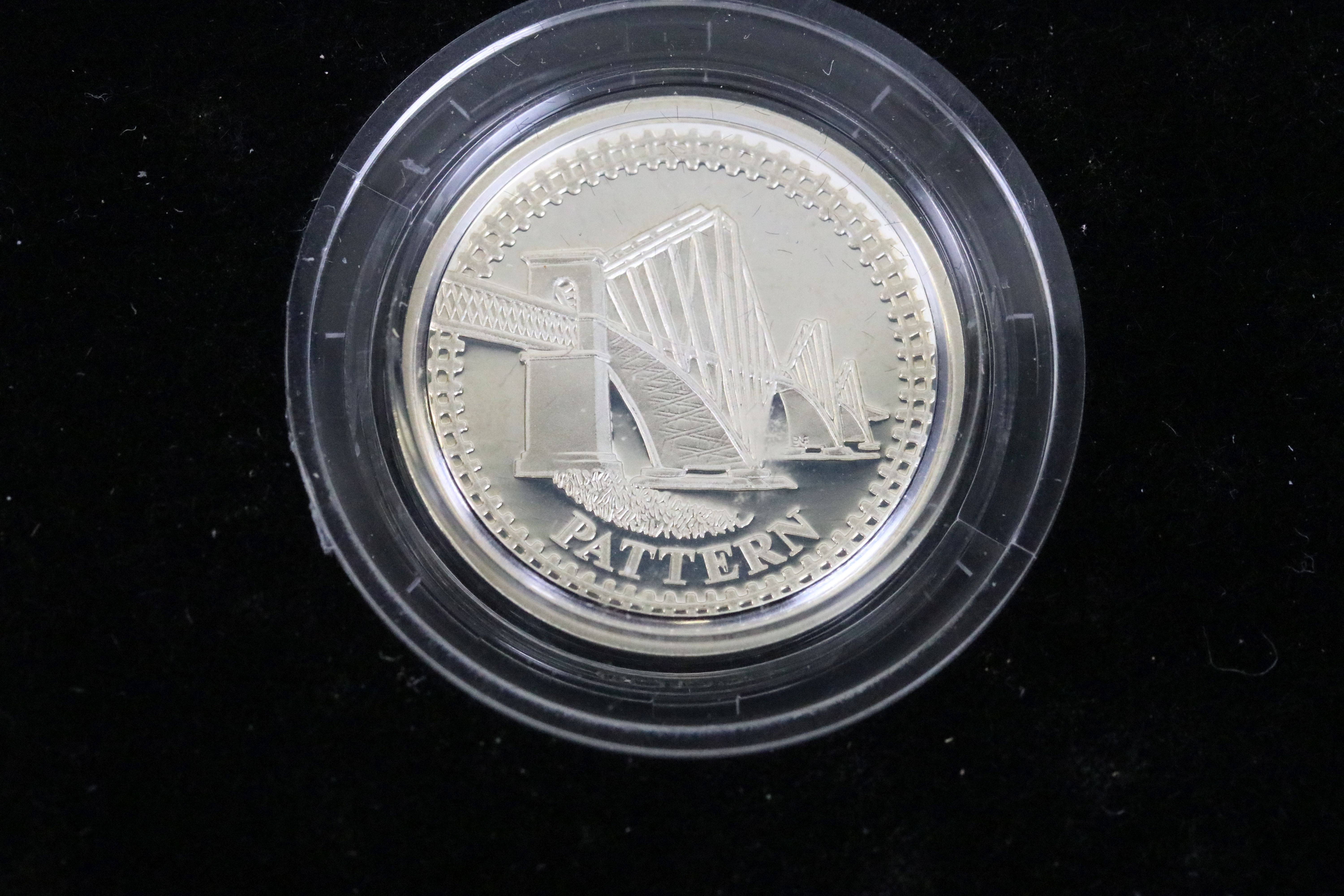 A Royal Mint United Kingdom silver proof £1 four coin pattern collection encapsulted within fitted - Image 2 of 6