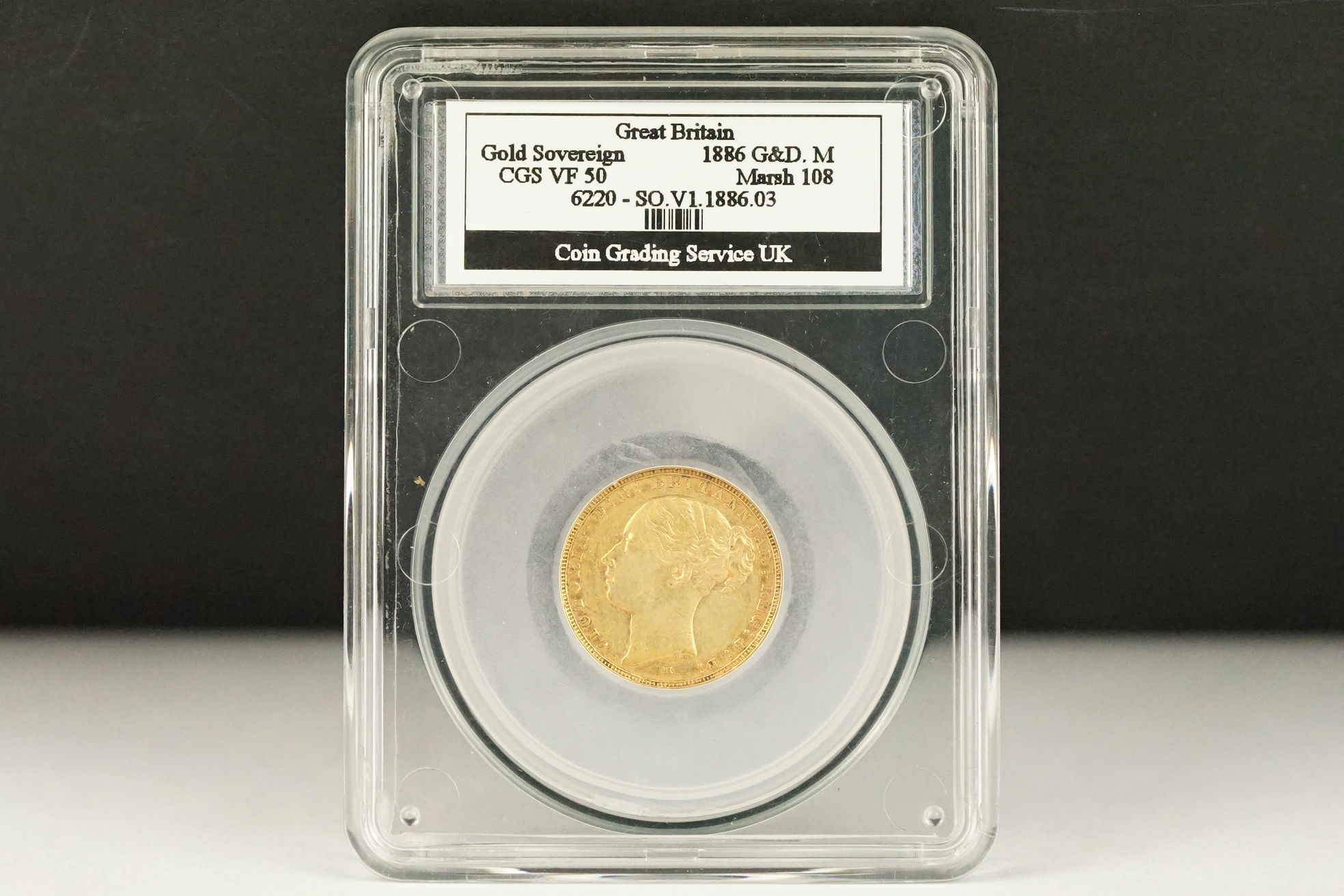 A Queen Victoria 1886 Melbourne Mint gold full sovereign coin, CGS slab mounted.
