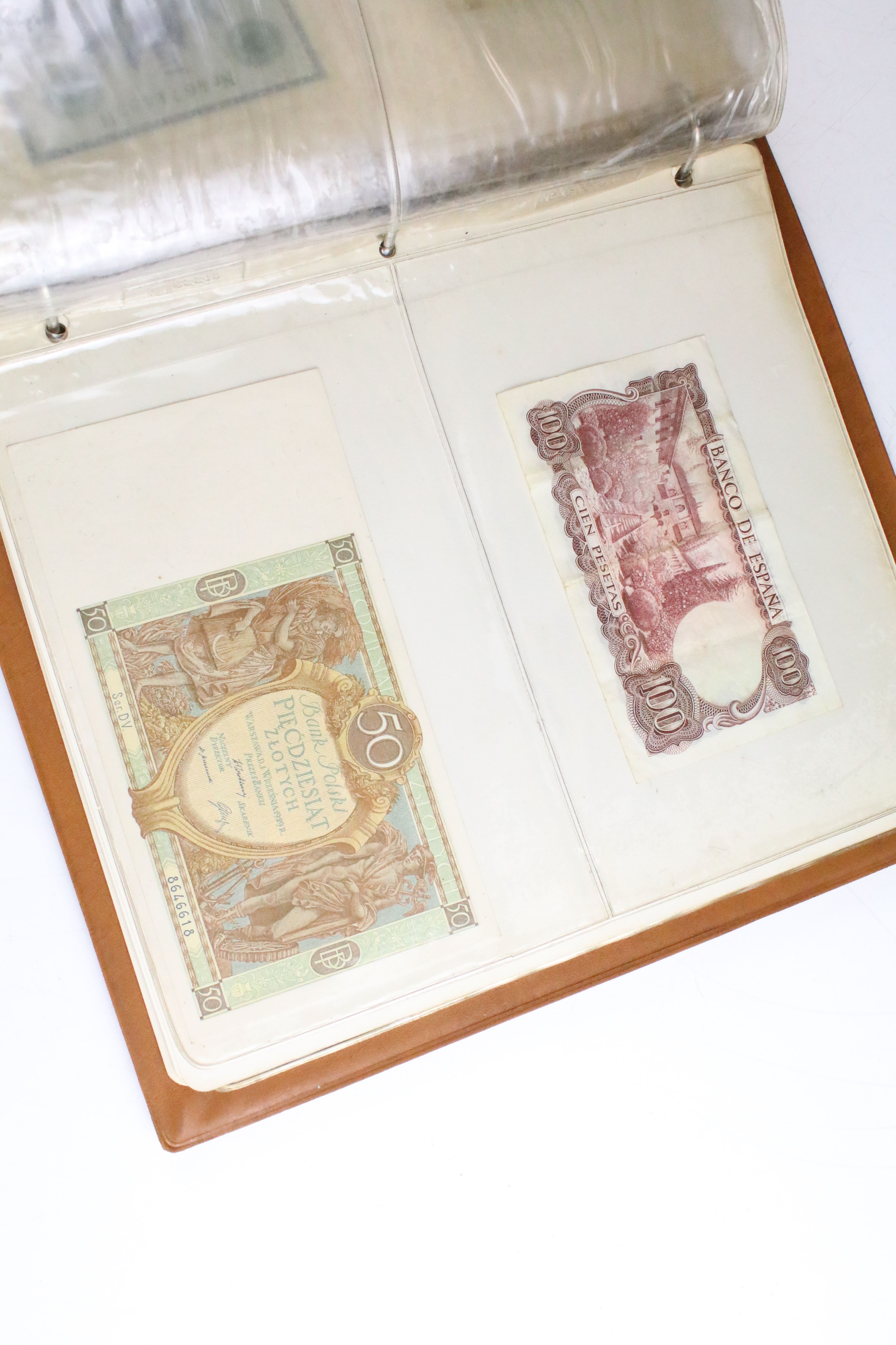 A small collection of British and World banknotes contained within a collectors album. - Image 5 of 9