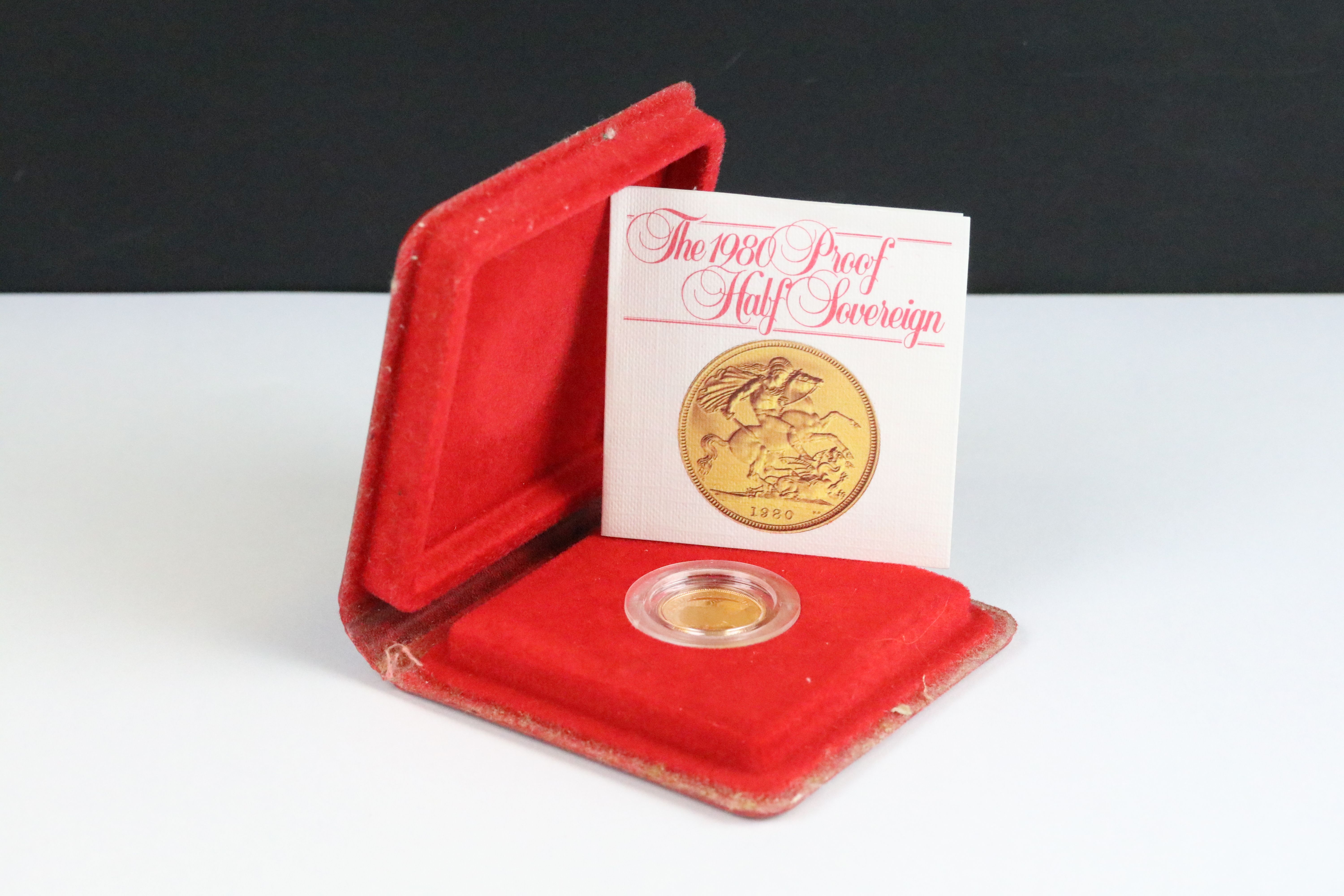 A British Royal Mint Queen Elizabeth II proof 1980 gold half sovereign coin encapsulated within