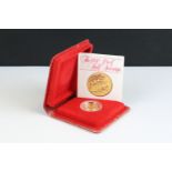 A British Royal Mint Queen Elizabeth II proof 1980 gold half sovereign coin encapsulated within
