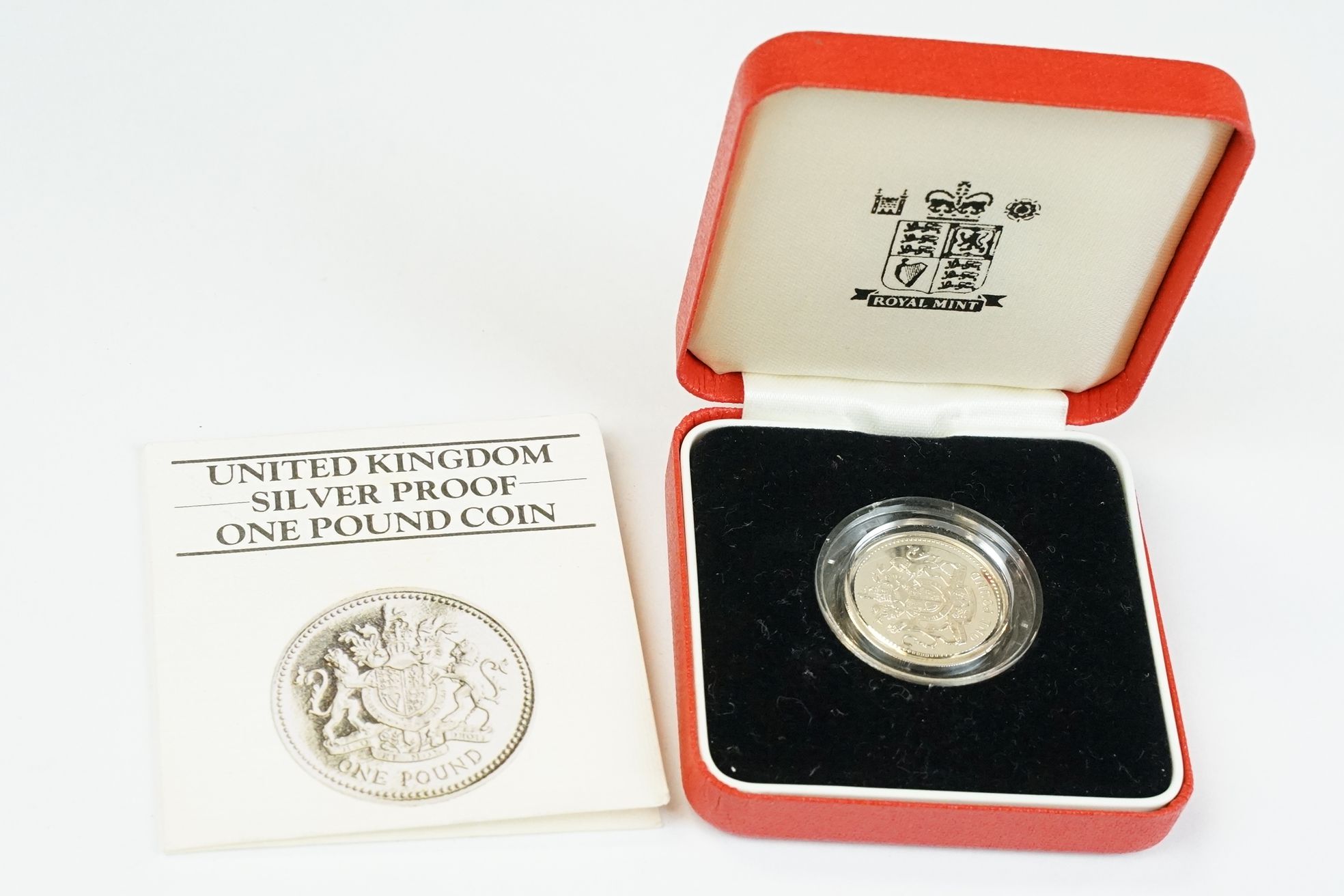A collection of four Royal Mint silver proof £1 coins to include 2002, 1985, 1983 and 1988 examples, - Image 2 of 13
