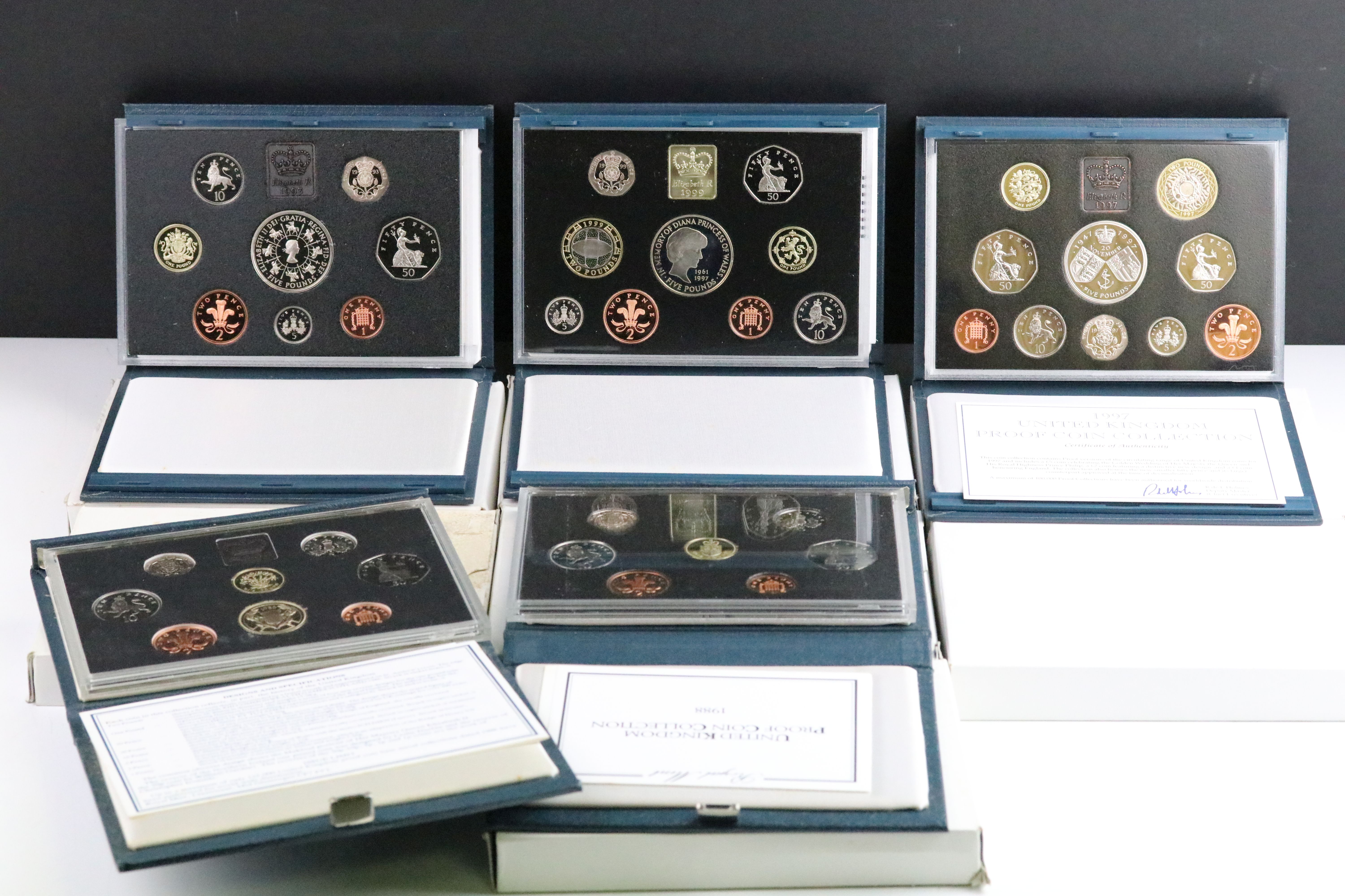 A collection of eight United Kingdom Royal Mint proof year sets to include 1992, 1998, 1989, 1988,