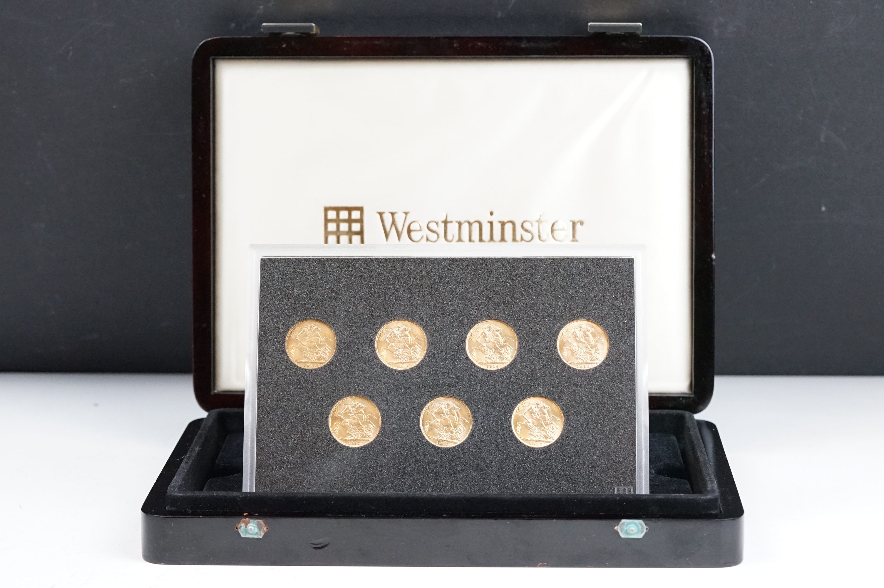 A Westminster Mint cased set of seven King George V gold full sovereign coins to include 1918 (