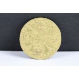 A British King George I 1718 gold quarter guinea coin. (V/F).