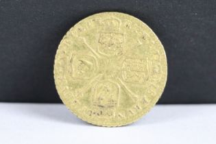 A British King George I 1718 gold quarter guinea coin. (V/F).