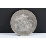 A British King George III 1819 silver crown coin.