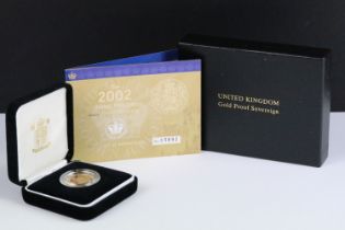 A British Royal Mint Queen Elizabeth II proof 2002 gold full sovereign coin encapsulated within
