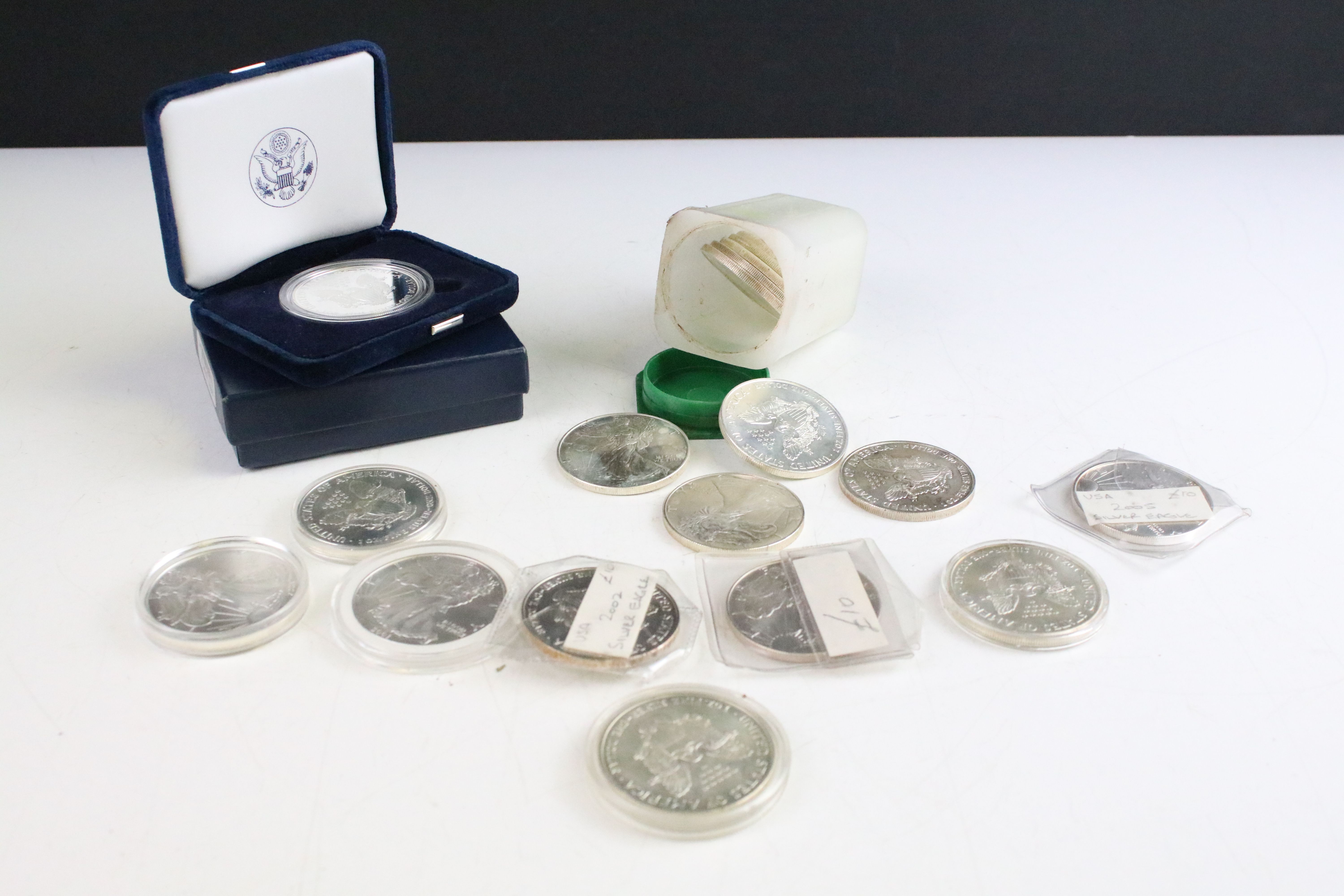 A collection of eighteen United States of America fine silver dollar coins to include proof