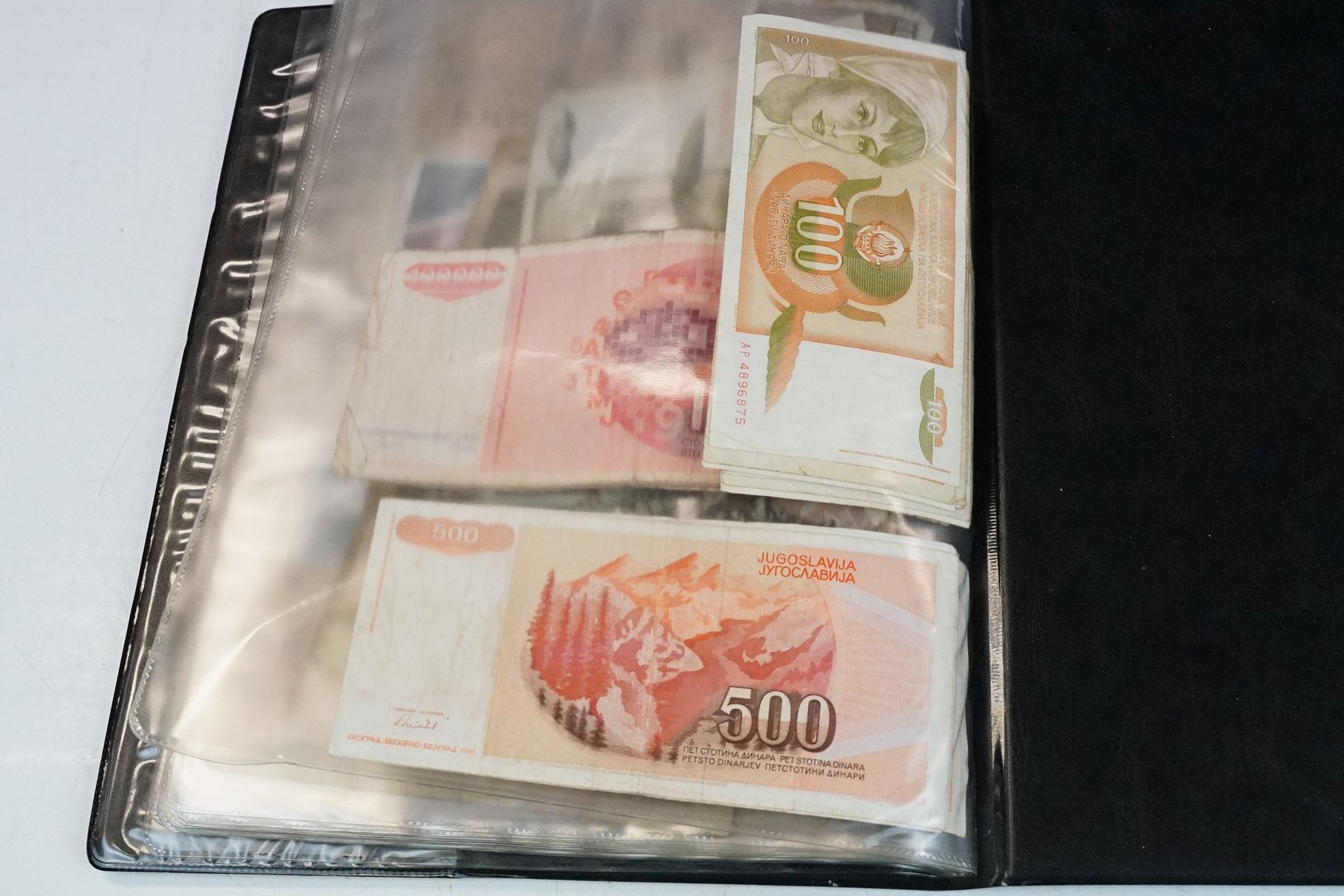 A collection of British and World banknotes contained within a folder to include China, Germany, - Bild 19 aus 19