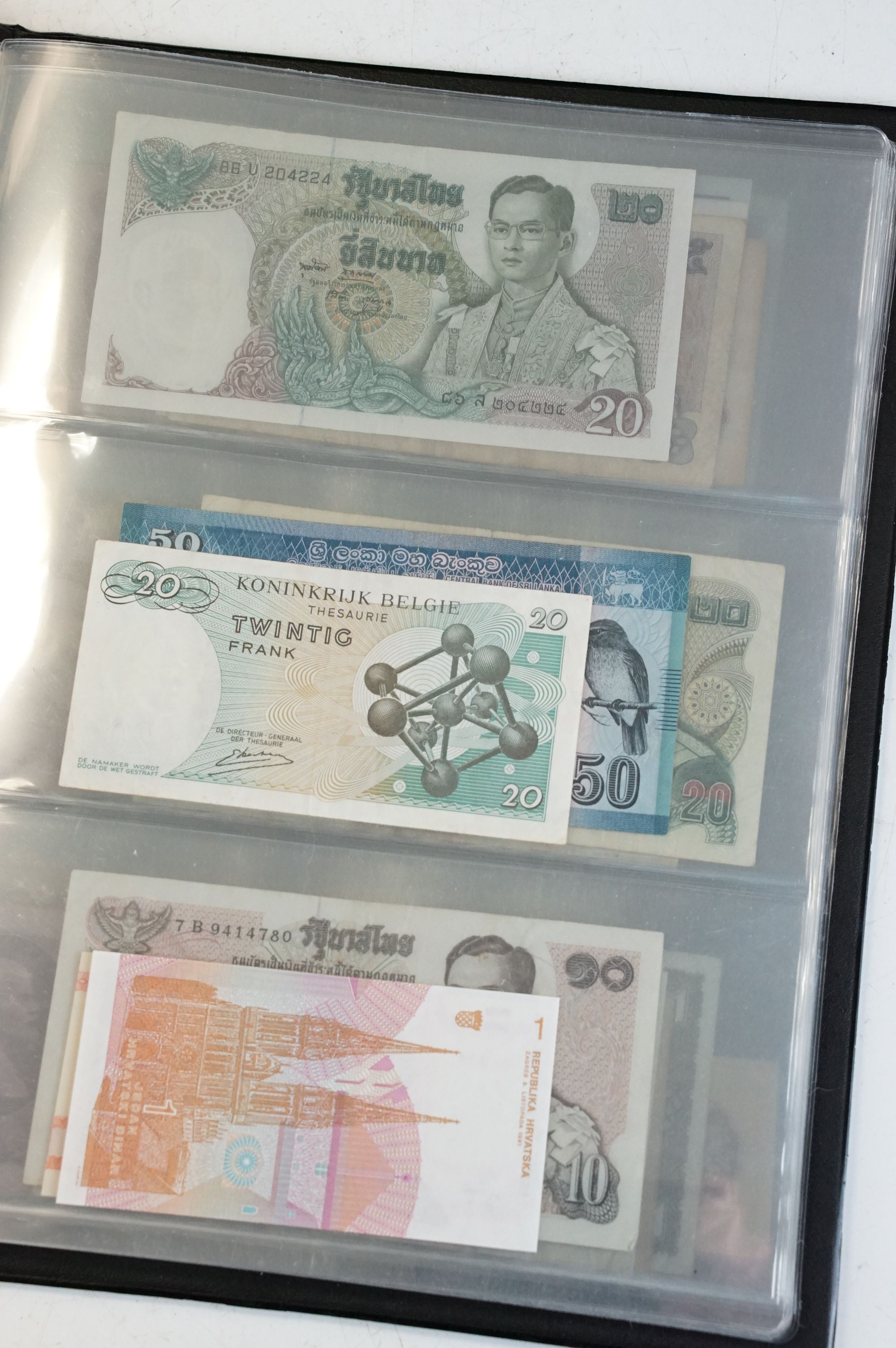 A collection of circulated and uncirculated world banknotes within a collectors folder to include - Image 7 of 12