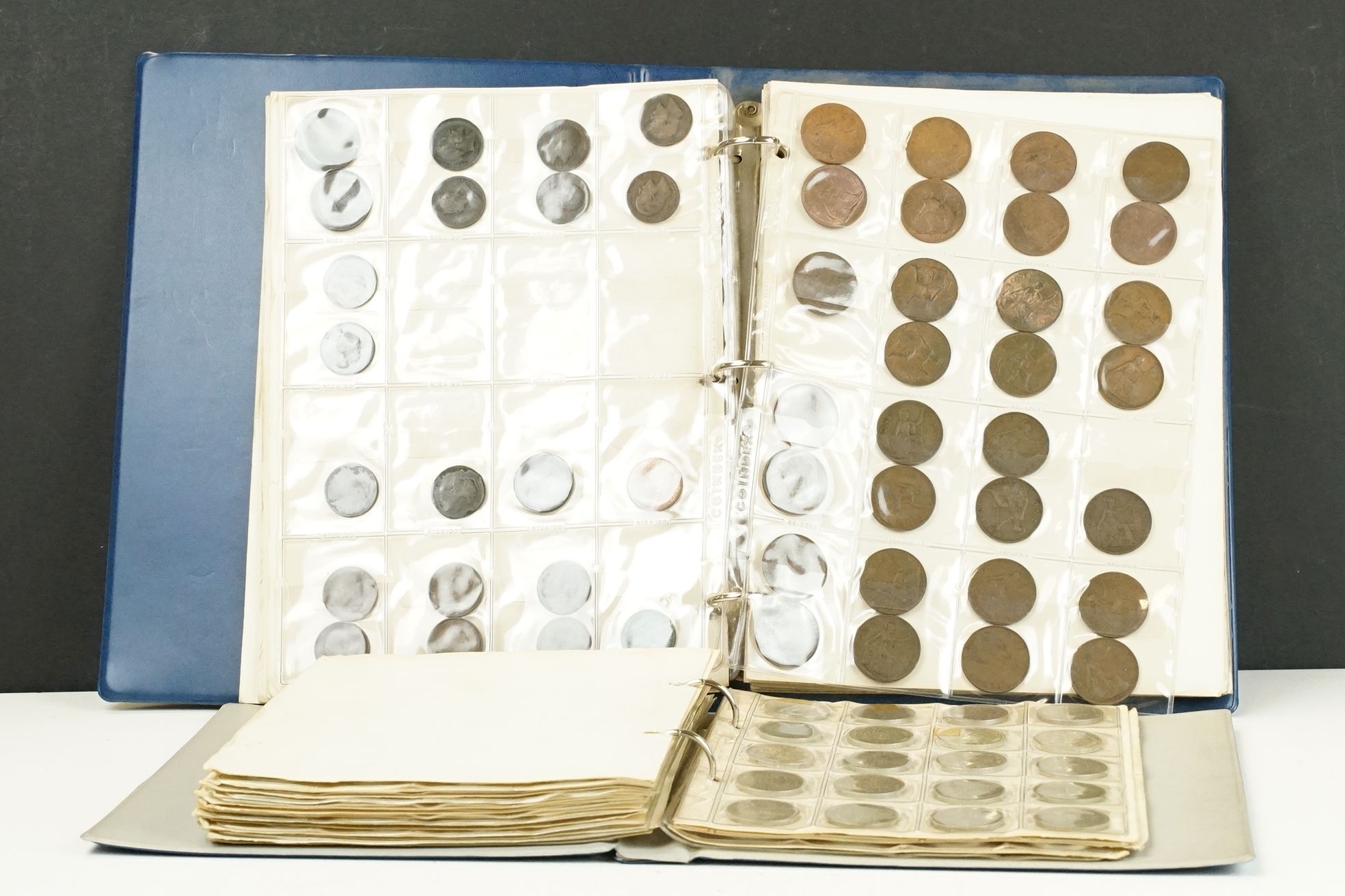 A collection of mainly British pre decimal coins within two collectors albums to include a good