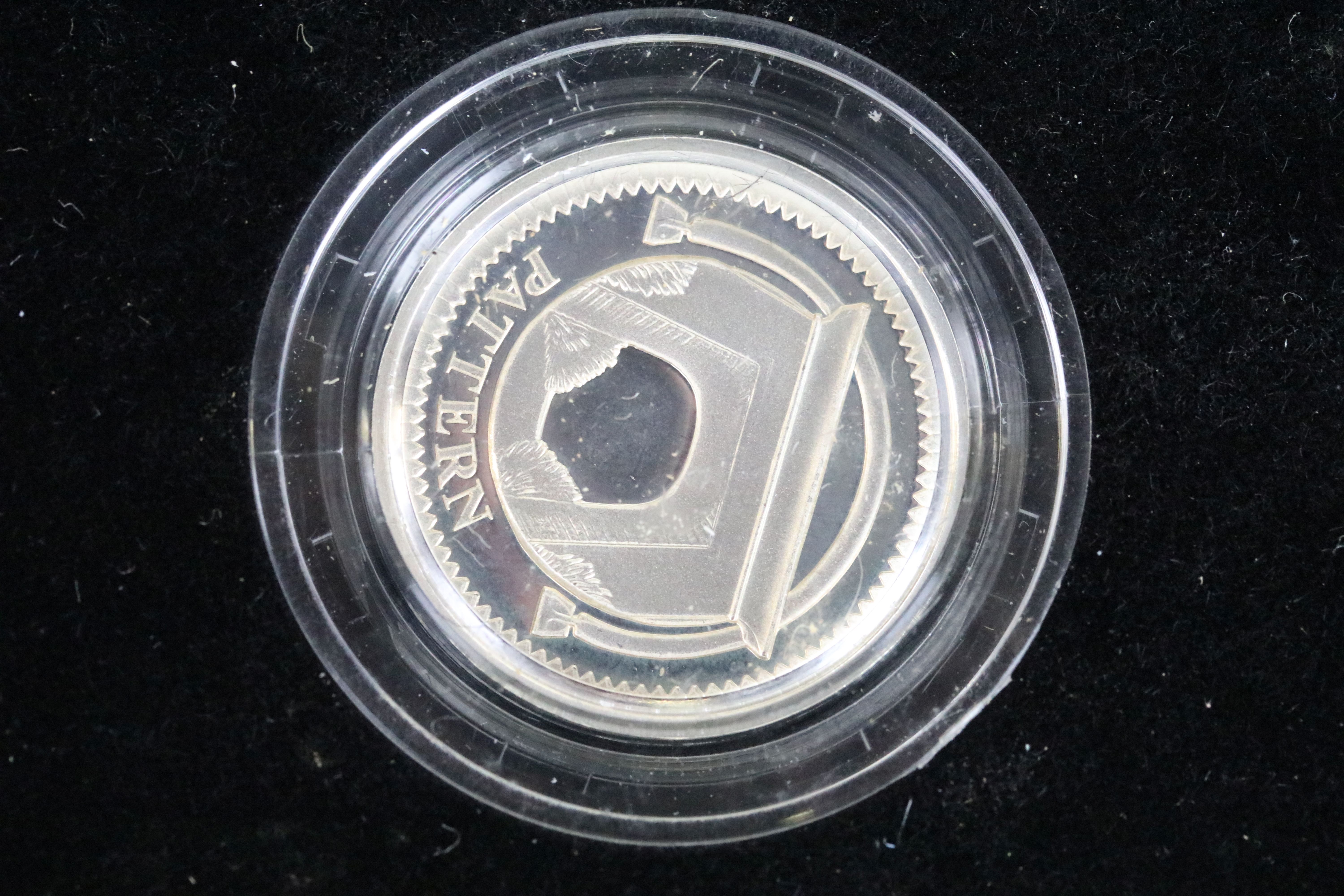 A Royal Mint United Kingdom silver proof £1 four coin pattern collection encapsulted within fitted - Image 4 of 6