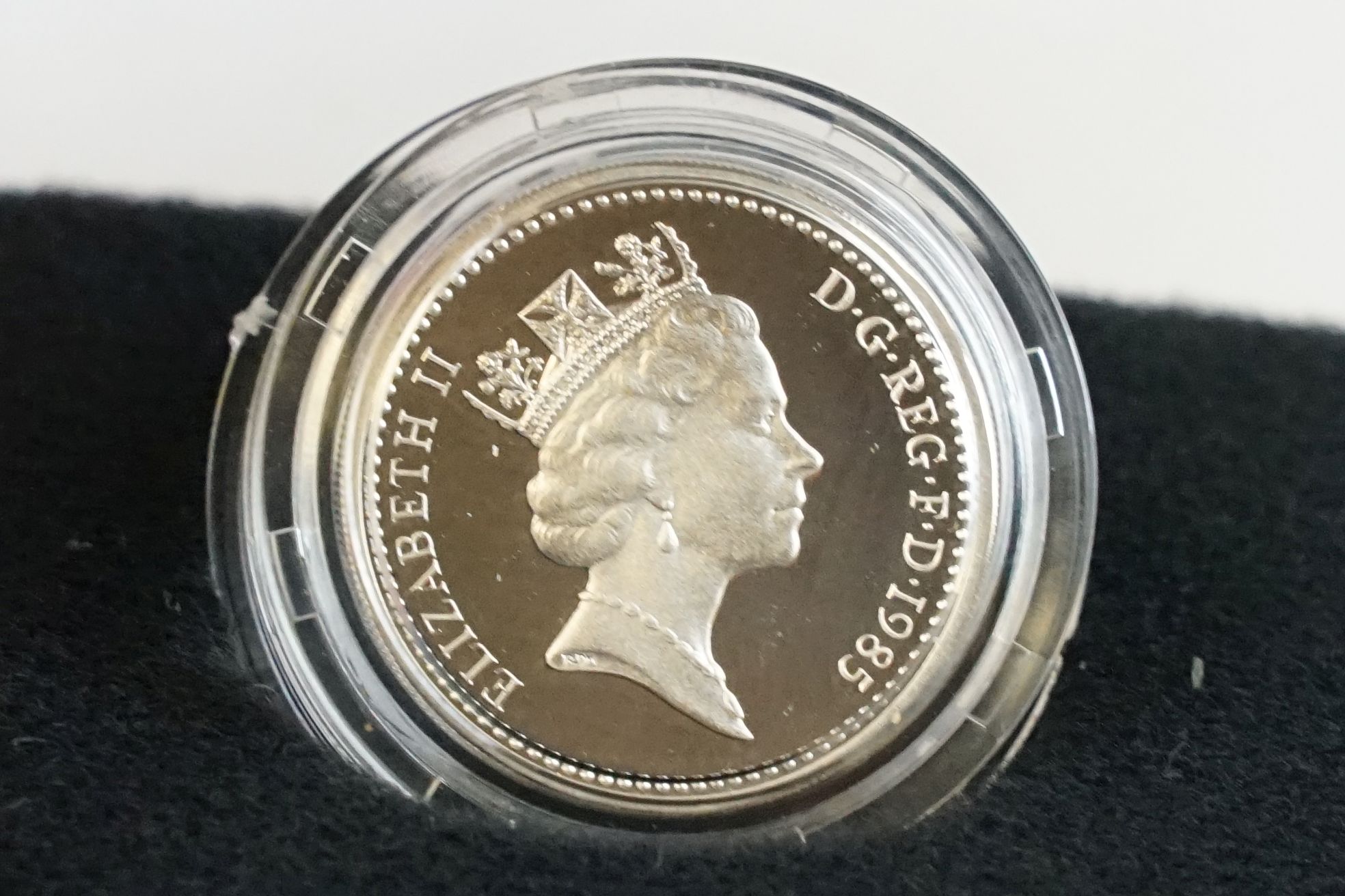 A collection of four Royal Mint silver proof £1 coins to include 2002, 1985, 1983 and 1988 examples, - Image 7 of 13