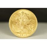 A British King George V 1915 gold full sovereign coin.