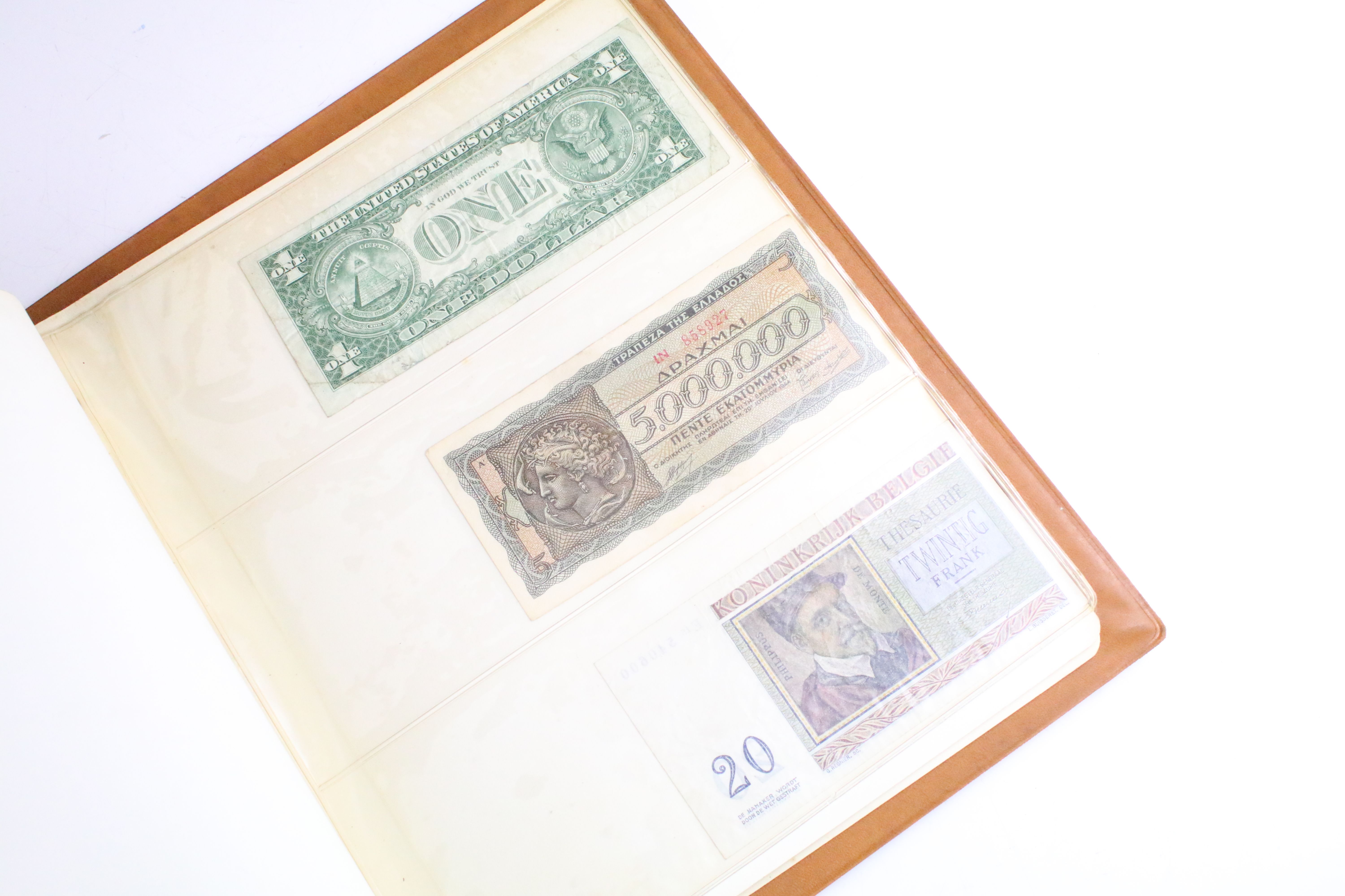 A small collection of British and World banknotes contained within a collectors album. - Image 7 of 9