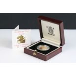A British Royal Mint Queen Elizabeth II proof 1991 gold full sovereign coin encapsulated within