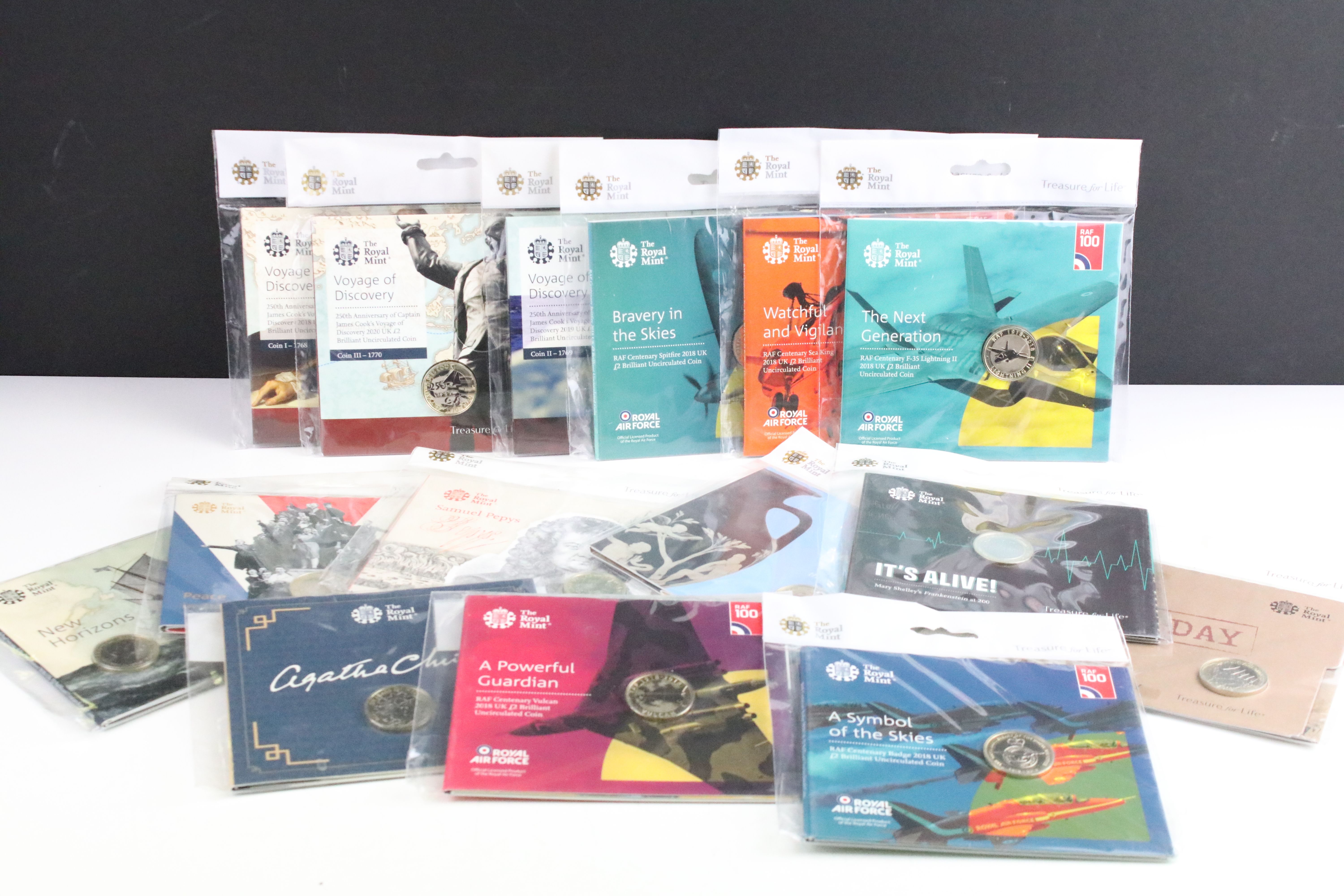 A collection of Fifteen Royal Mint uncirculated collectors £2 coin packs to include Agatha Christie,