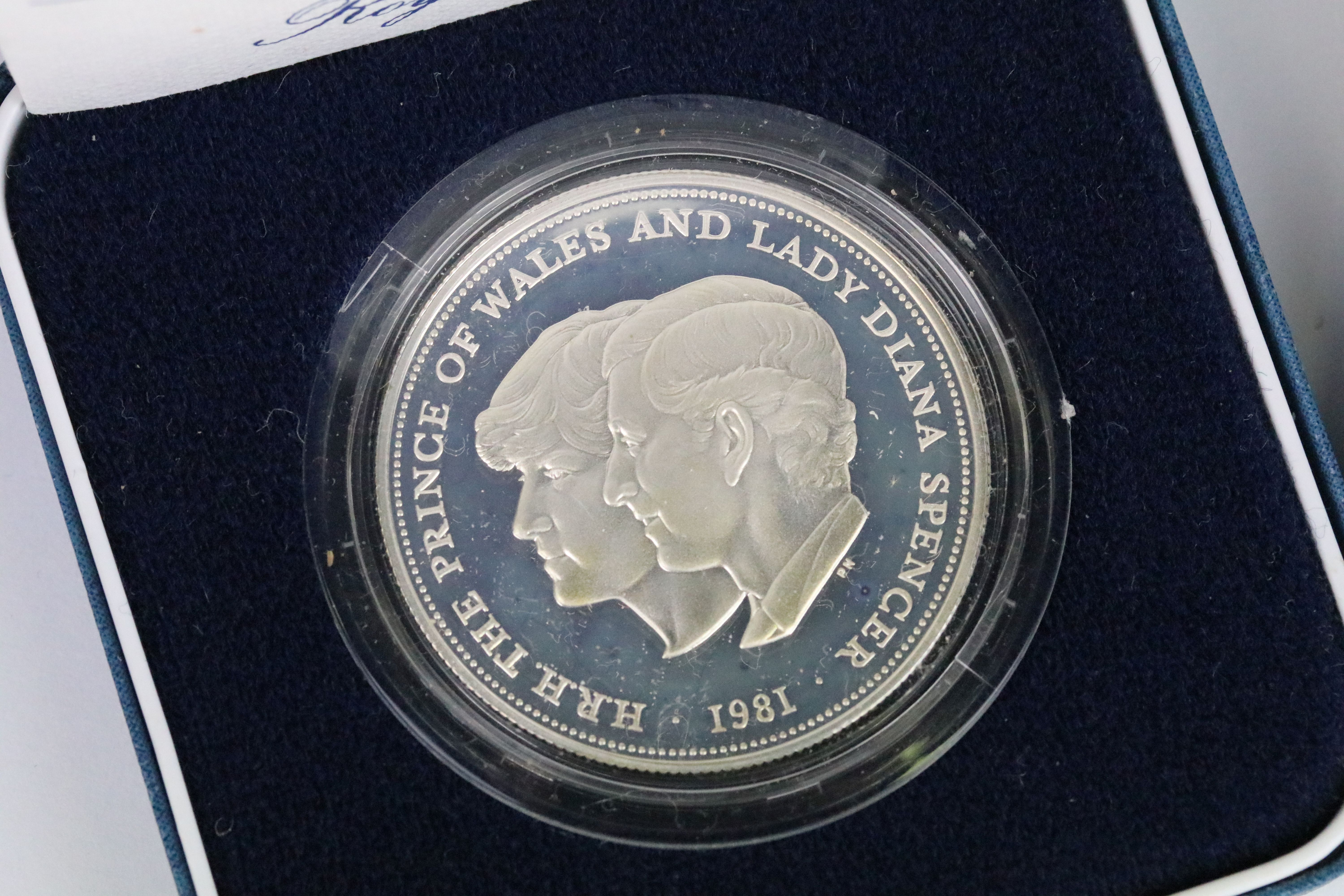 A collection of four Royal Mint silver proof crown coins all encapsulated within display cases. - Image 3 of 9