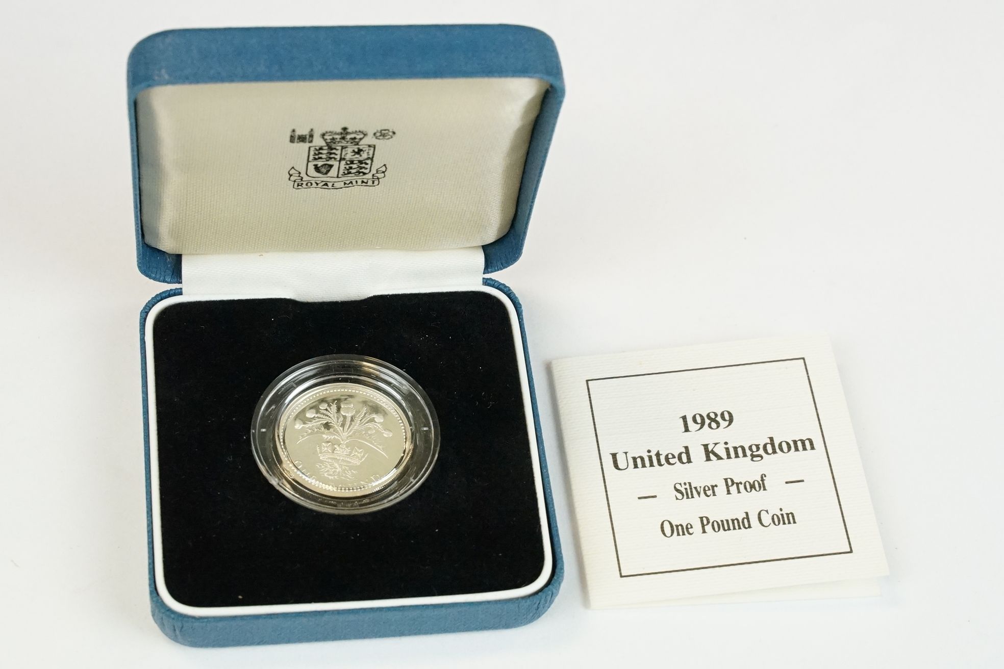 A collection of four Royal Mint silver proof £1 coins to include 2002, 2003, 1989 and 1984 examples, - Image 8 of 13
