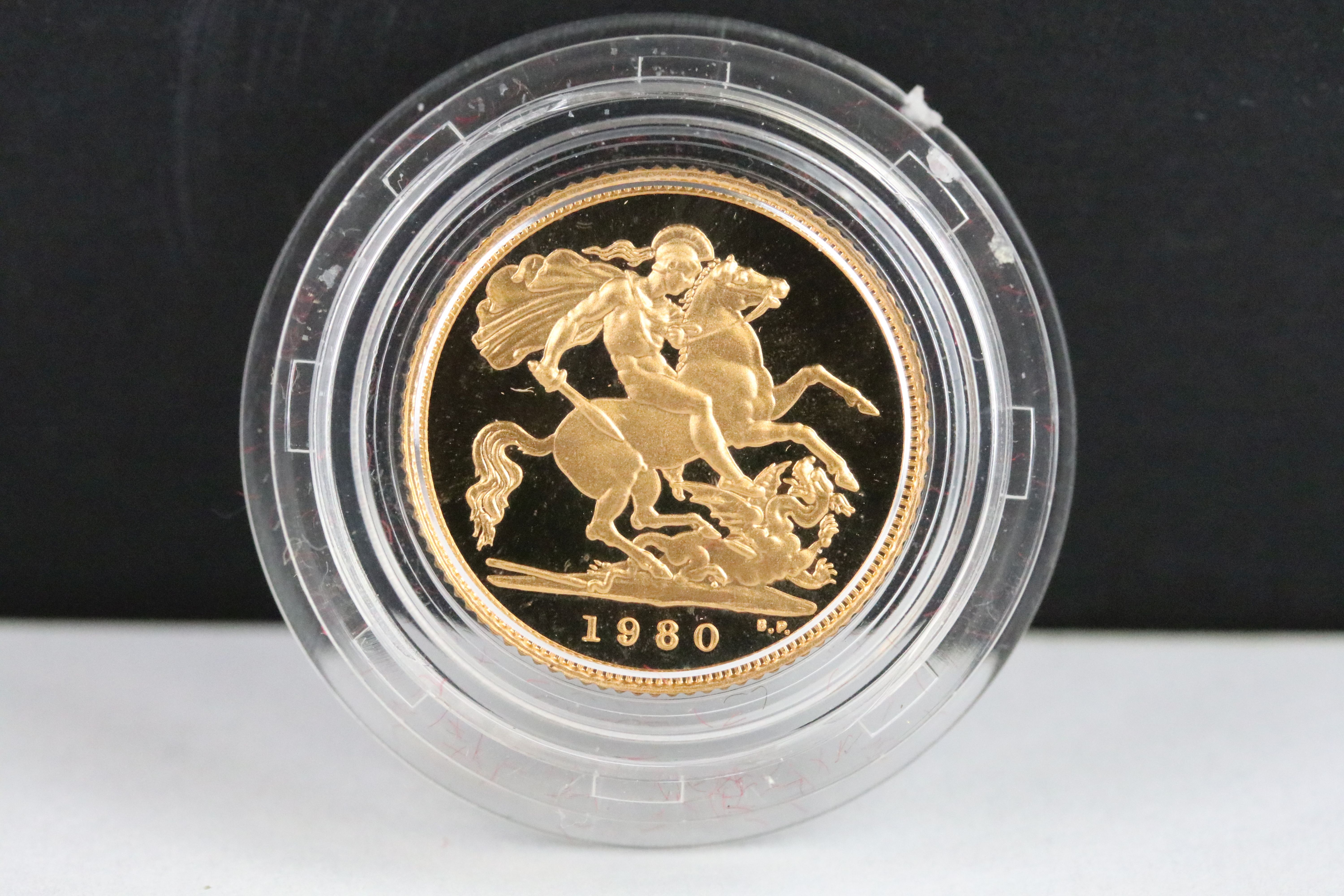 A British Royal Mint Queen Elizabeth II proof 1980 gold half sovereign coin encapsulated within - Image 2 of 4