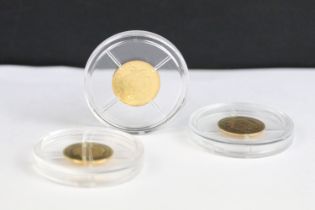 A group of three gold coins to include 'The Year of the Three Kings' and a 'Princess Diana' example.