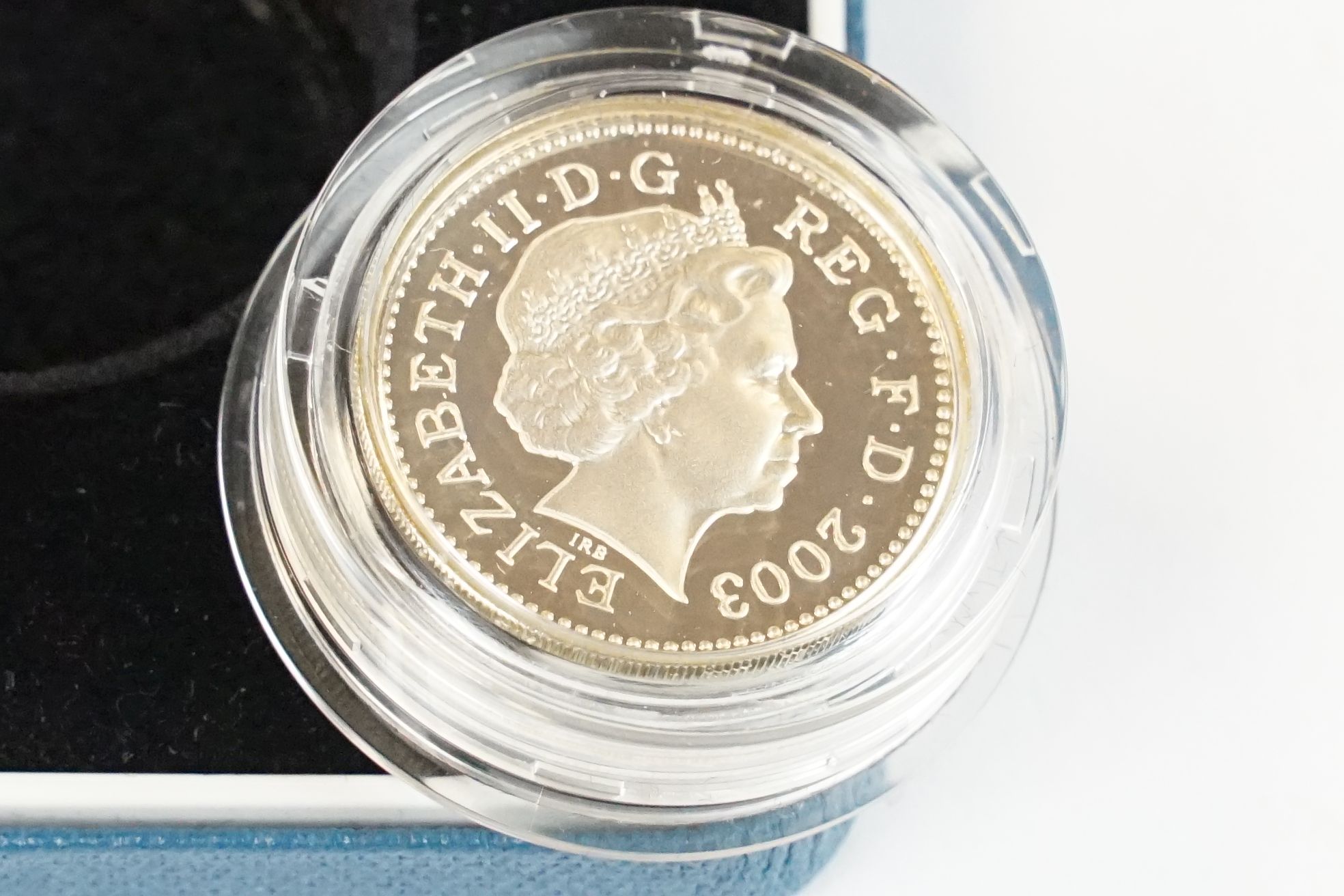 A collection of four Royal Mint silver proof £1 coins to include 2002, 2003, 1989 and 1984 examples, - Image 7 of 13